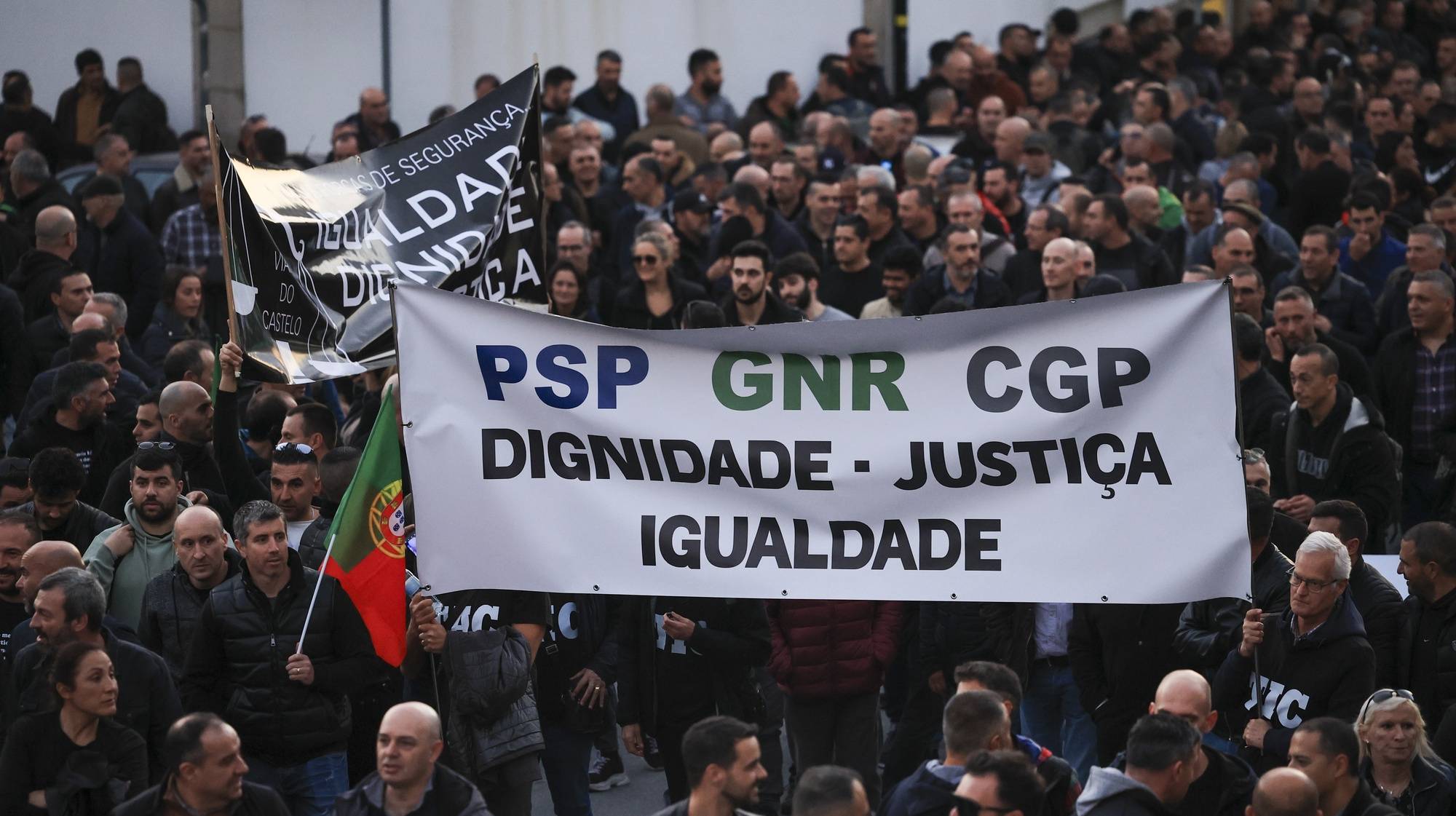 Police officers hold a banner with the words &quot;Dignity, Justice, Equality&quot; protest during a demonstration by the platform of PSP (Public Security Police) unions and GNR (National Republican Guard) associations for the restructuring of pay supplements and for the enhancement and dignification of professionals, Porto, Portugal, 31 January 2024.  ESTELA SILVA/LUSA