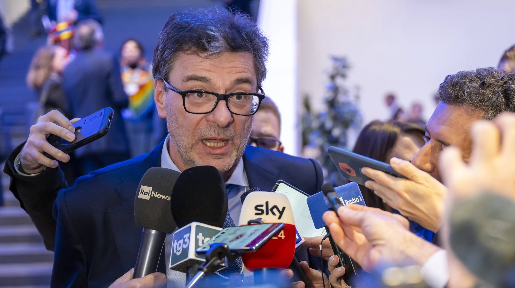 epa11085500 Minister of Economy and Finance of Italy Giancarlo Giorgetti, speaks to journalists during the 54th annual meeting of the World Economic Forum (WEF), in Davos, Switzerland, 17 January 2024. The meeting brings together entrepreneurs, scientists, corporate and political leaders in Davos under the topic &#039;Rebuilding Trust&#039; from 15 to 19 January.  EPA/LAURENT GILLIERON