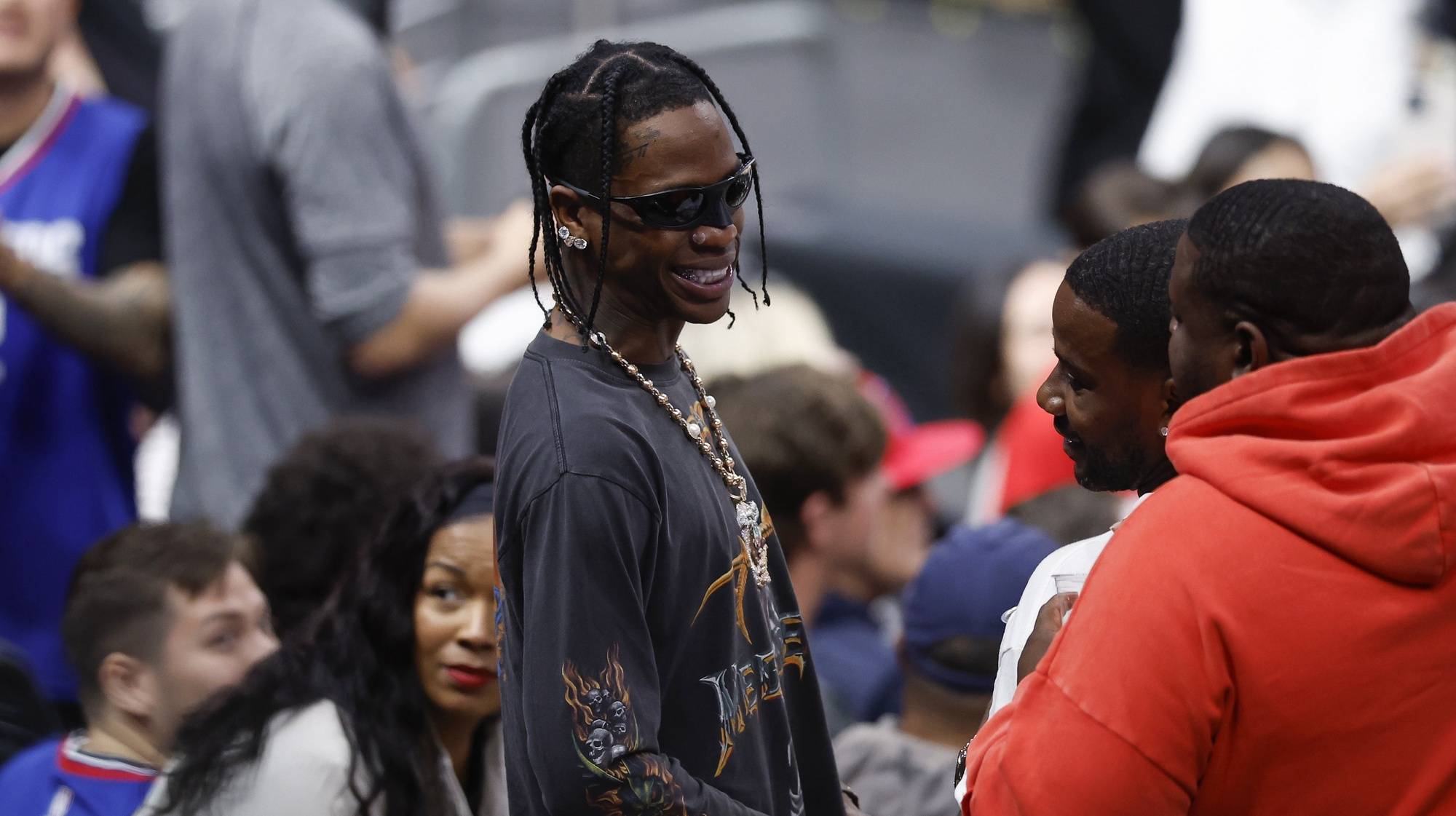 epa11210181 American rapper Travis Scott attends the NBA basketball game between the Chicago Bulls and the Los Angeles Clippers in Los Angeles, California, USA, 09 March 2024.  EPA/CAROLINE BREHMAN  SHUTTERSTOCK OUT