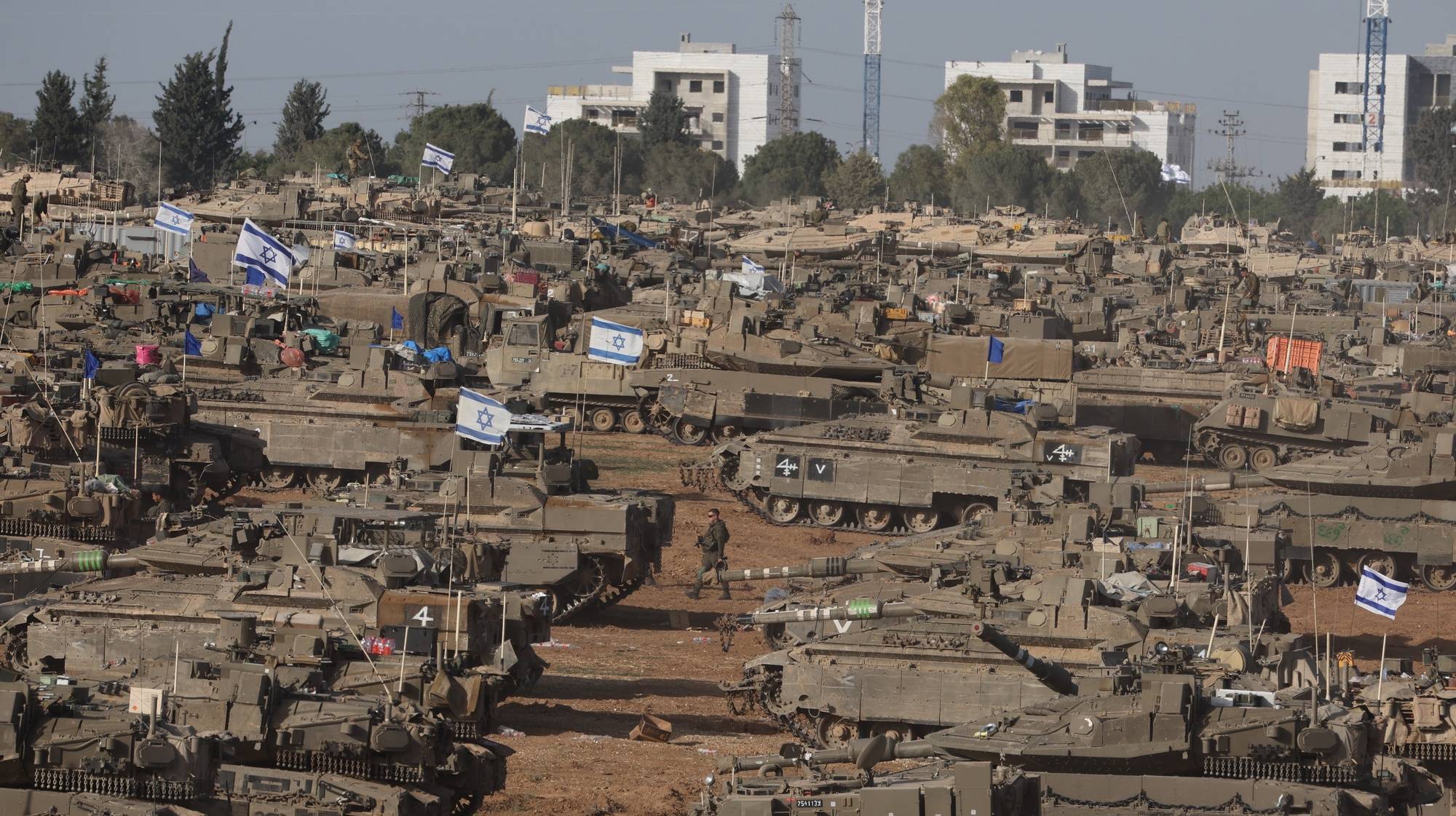 epa11329410 Israeli military vehicles gathered near the border fence with the Gaza Strip, at an undisclosed location in southern Israel, 09 May 2024. On 07 May, Israel said that its troops began an operation targeting Hamas militants and infrastructure within specific areas of eastern Rafah, taking operational control of the Gazan side of the Rafah crossing. The United States on 08 May confirmed the decision to pause a shipment of &#039;high payload munitions&#039; to Israel. More than 34,900 Palestinians and over 1,455 Israelis have been killed, according to the Palestinian Health Ministry and the Israel Defense Forces (IDF), since Hamas militants launched an attack against Israel from the Gaza Strip on 07 October 2023, and the Israeli operations in Gaza and the West Bank which followed it.  EPA/ABIR SULTAN