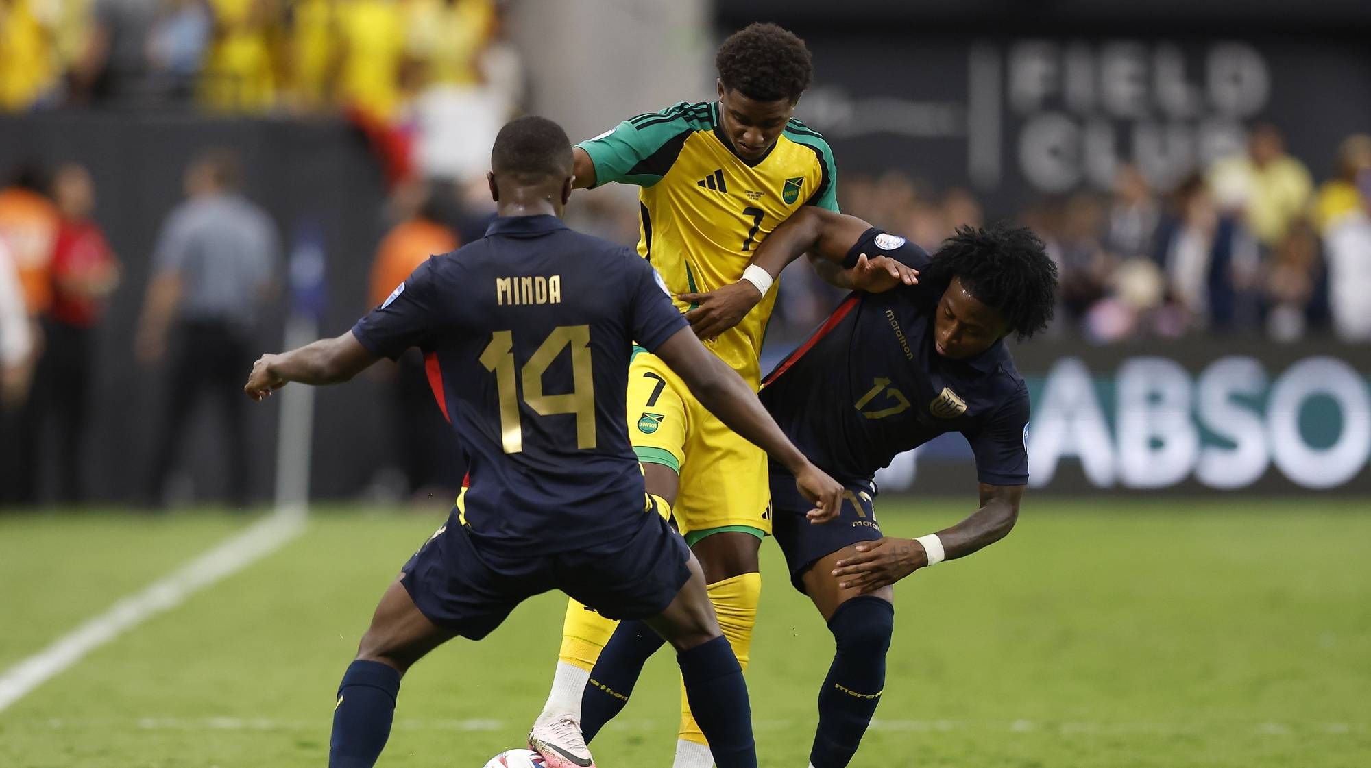 epa11440689 Ecuador defender Angelo Preciado (R) and Ecuador midfielder Alan Minda (L) battle with Jamaica midfielder Demarai Gray (C) during the second half of the CONMEBOL Copa America 2024 group B match between Ecuador and Jamaica, in Paradise, Nevada, USA, 26 June 2024.  EPA/CAROLINE BREHMAN