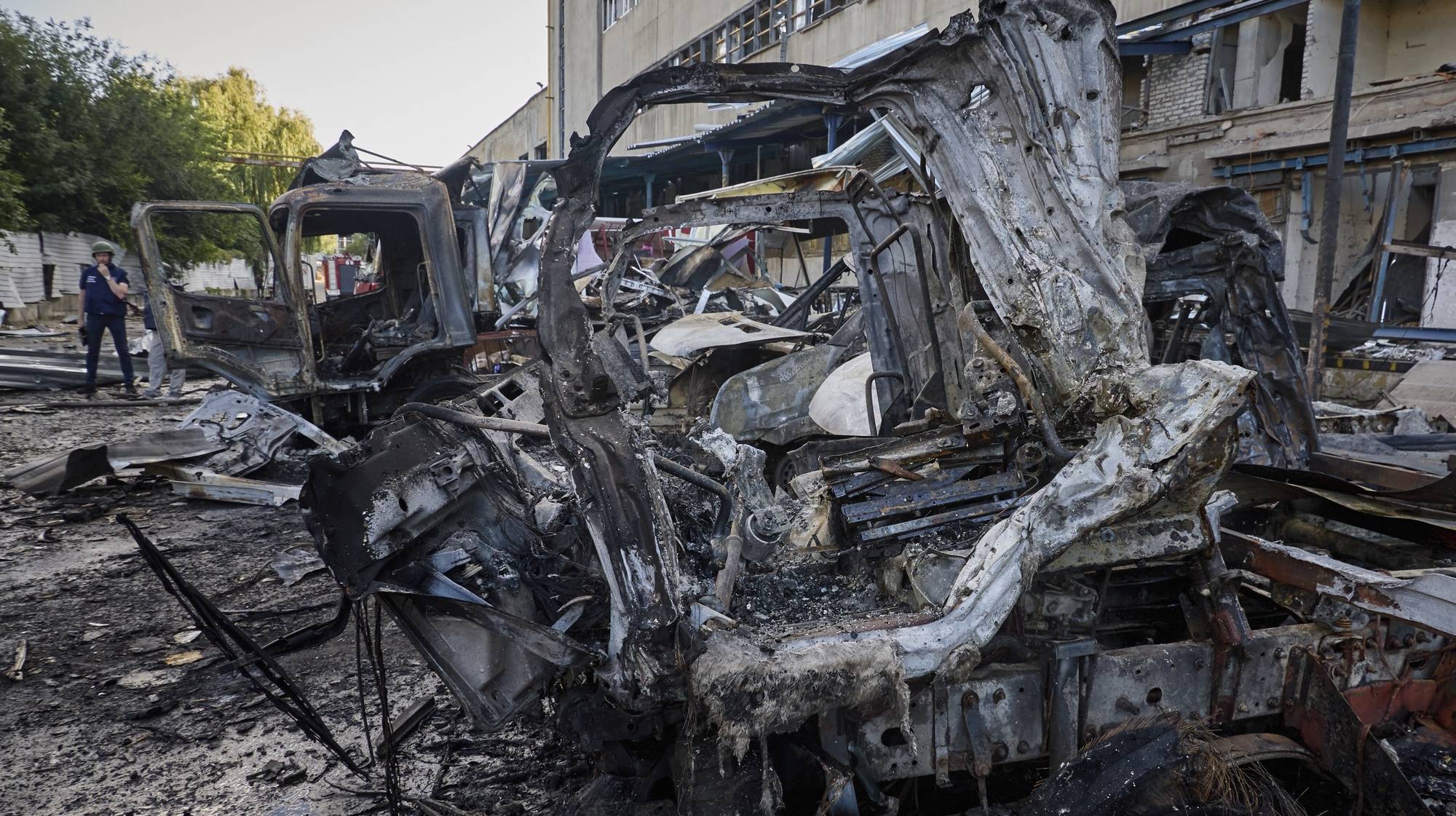 epa11448362 Rescuers work at the site of a glide bomb hit on a postal terminal in Kharkiv, northeastern Ukraine, 30 June 2024, amid the Russian invasion. At least one person was killed and 10 others injured, including an 8-month-old child, after a Russian glide bomb hit a Nova Post postal terminal in Kharkiv, according to the State Emergency Service of Ukraine (SESU). Russian troops entered Ukrainian territory in February 2022, starting a conflict that has provoked destruction and a humanitarian crisis.  EPA/SERGEY KOZLOV