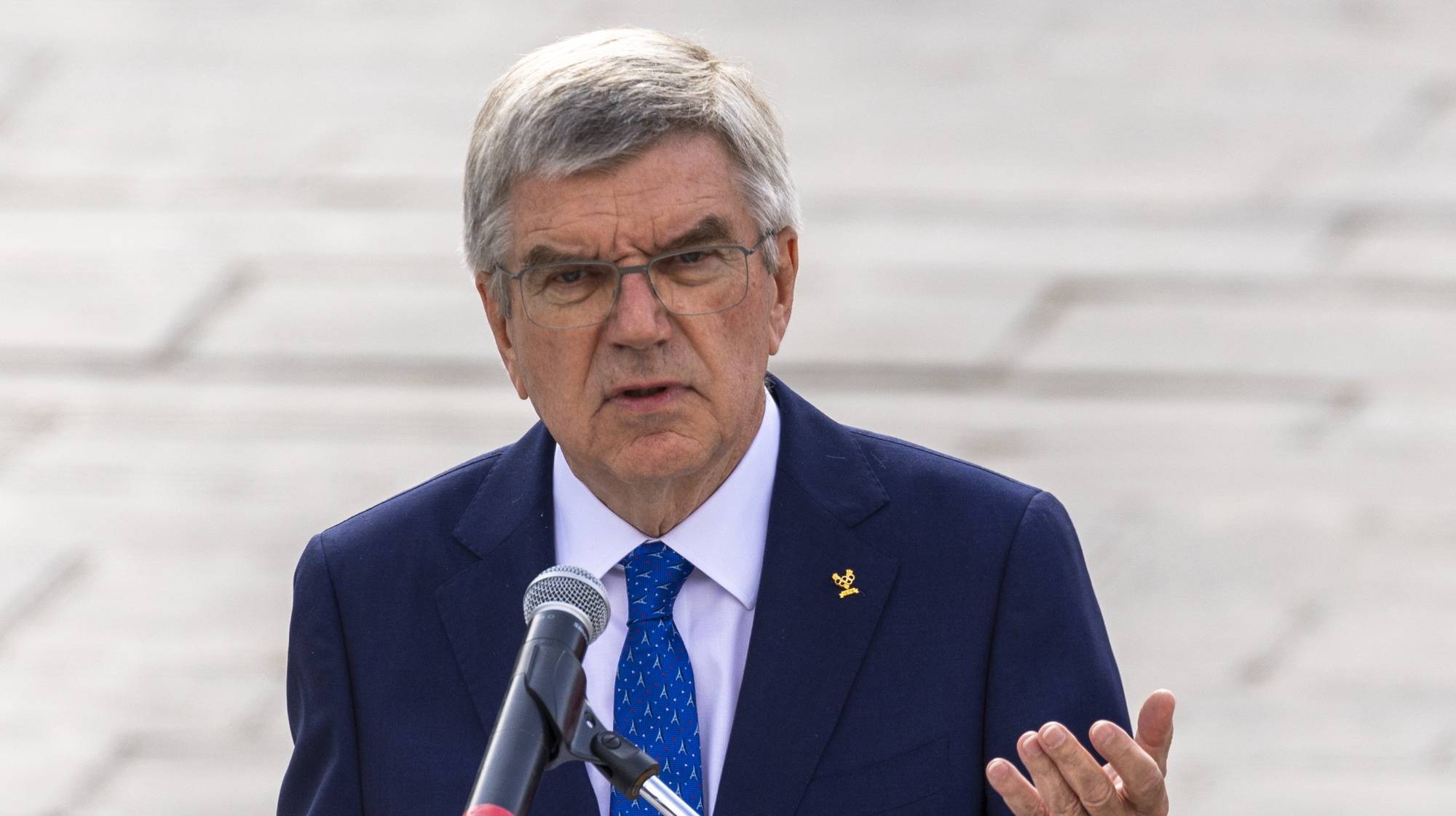 epa11524501 President of the International Olympic Committee Thomas Bach delivers a speech during the interreligious meeting in Paris, France, 04 August 2024. On the occasion of the Paris 2024 Olympic Games and commemorating the interfaith ceremony that took place at the last Paris Games in 1924, representatives of the five religions met on the forecourt of Notre Dame de Paris Cathedral.  EPA/ANDRE PAIN