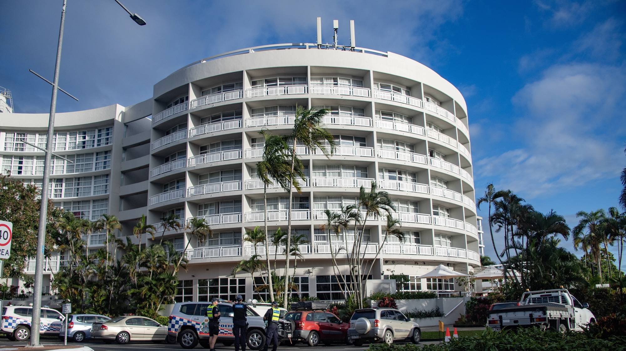 epa11546230 Emergency service works are seen at the Double Tree by Hilton Hotel after a helicopter crashed into its roof, in Cairns, Australia 12 August 2024. Police have declared a Public Safety Preservation Act in Cairns after the chopper crashed into the building shortly before 2am on Monday, August 12.  EPA/BRIAN CASSEY AUSTRALIA AND NEW ZEALAND OUT