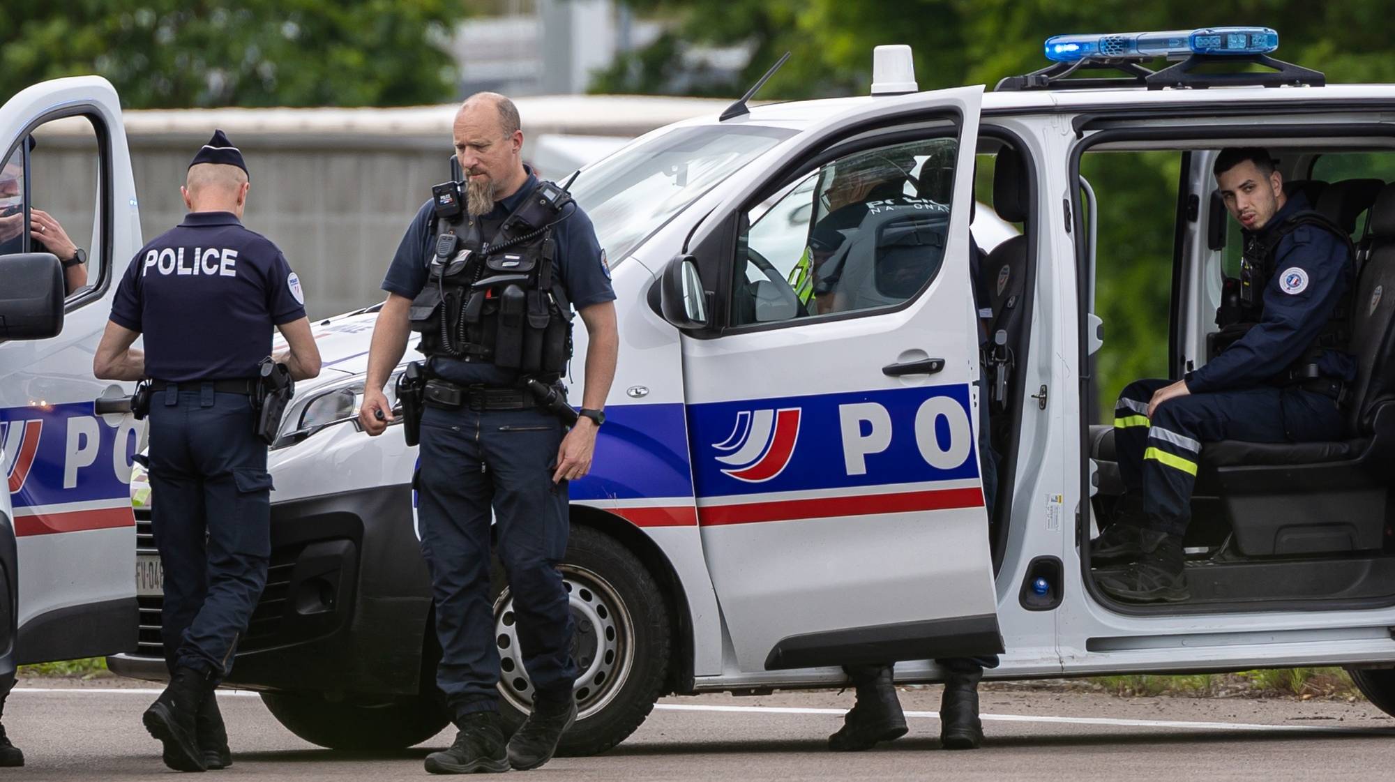 epa11339833 French policemen stand guard at the toll station of Incarville, near Rouen, in the North of France, where gunmen ambushed a prison van on 14 May 2024, killing two prison guards and helping a prisoner to escape. Three other prison guards were severely wounded, according to Justice minister Eric Dupond-Moretti. A major police manhunt has been launched to find the gunmen and the escaped prisoner,  identified as a 30-year-old drug dealer from northern France, according to the Paris prosecutor&#039;s office.  EPA/CHRISTOPHE PETIT TESSON