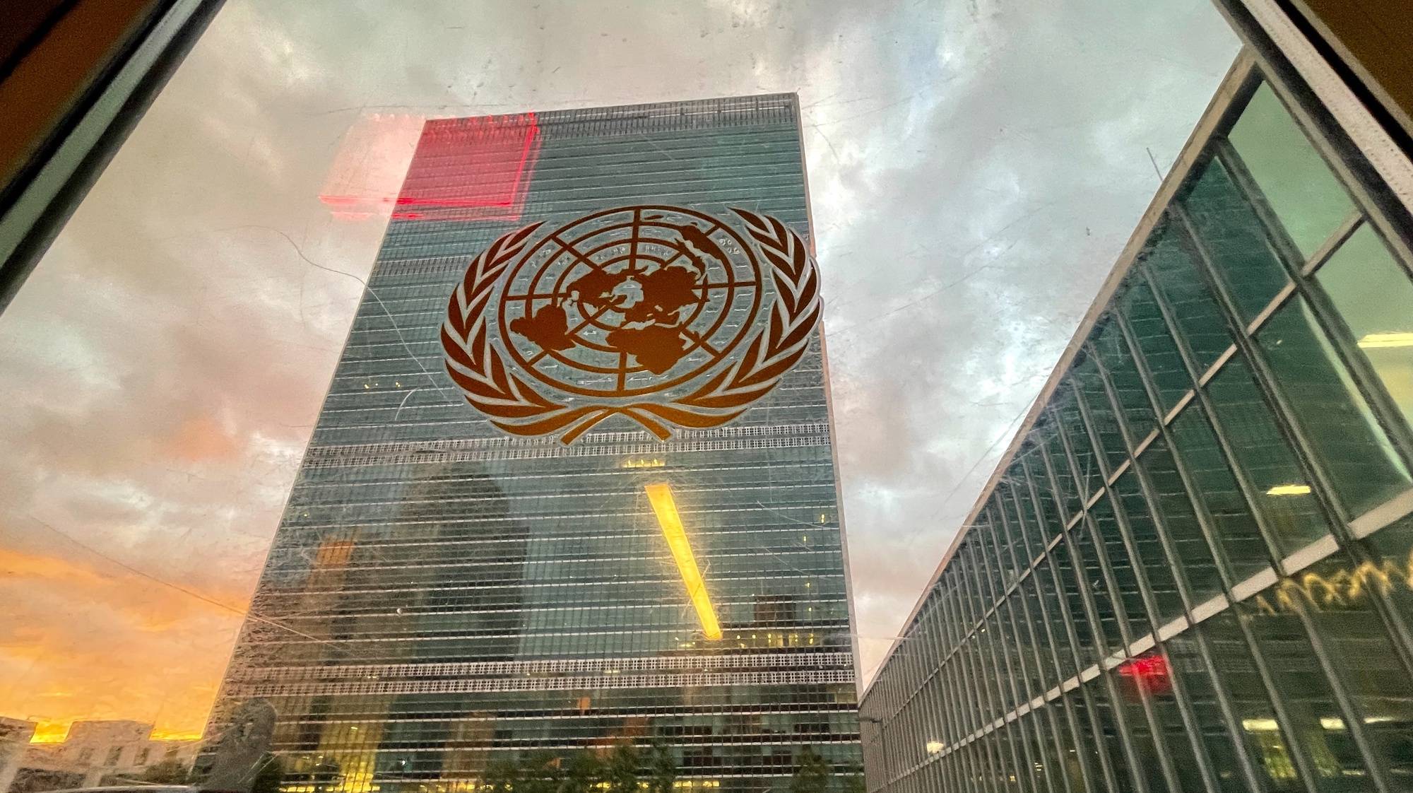 epa09479283 The United Nations headquarters building is seen from inside the General Assembly hall before heads of state begin to address the 76th Session of the U.N. General Assembly in New York City, USA, 21 September 2021.  EPA/EDUARDO MUNOZ / POOL