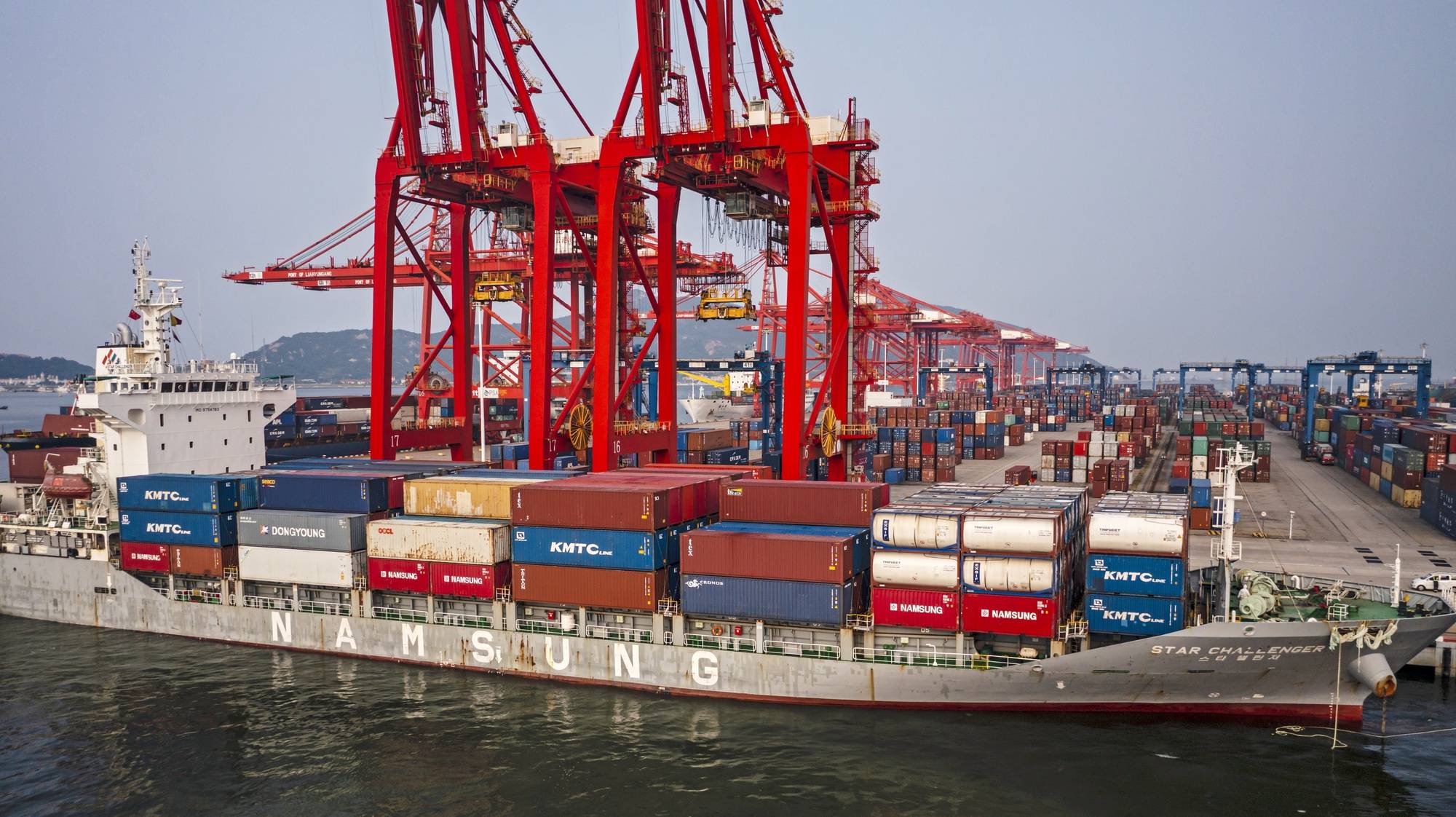 epa09473311 A photo made with a drone shows a ship docking to the Lianyungang Port during the organised media tour in Lianyungang, Jiangsu province, China, 17 September 2021. China-Kazakhstan Logistic Base
is an important sea port for Kazakhstan export and provides efficient transit for cargo and consumer goods from the central Asian country. It is recognised as a sample of collaboration between the &#039;The Belt And Road&#039; countries.  EPA/ALEX PLAVEVSKI