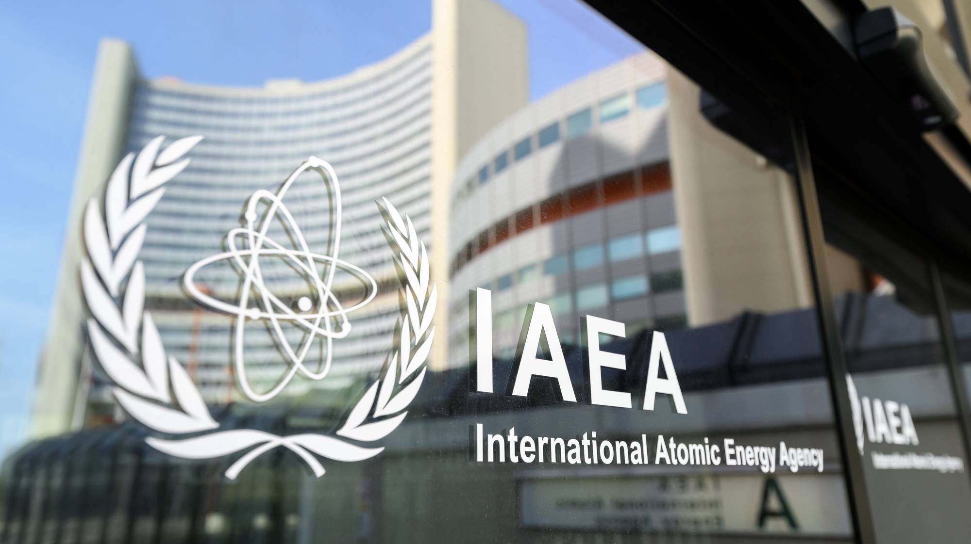 epa11272479 The UNO City is reflected on a door with the IAEA Logo before an International Atomic Energy Agency (IAEA) Board of Governors meeting at the IAEA headquarters of the United Nations seat in Vienna, Austria, 11 April 2024.  EPA/MAX SLOVENCIK