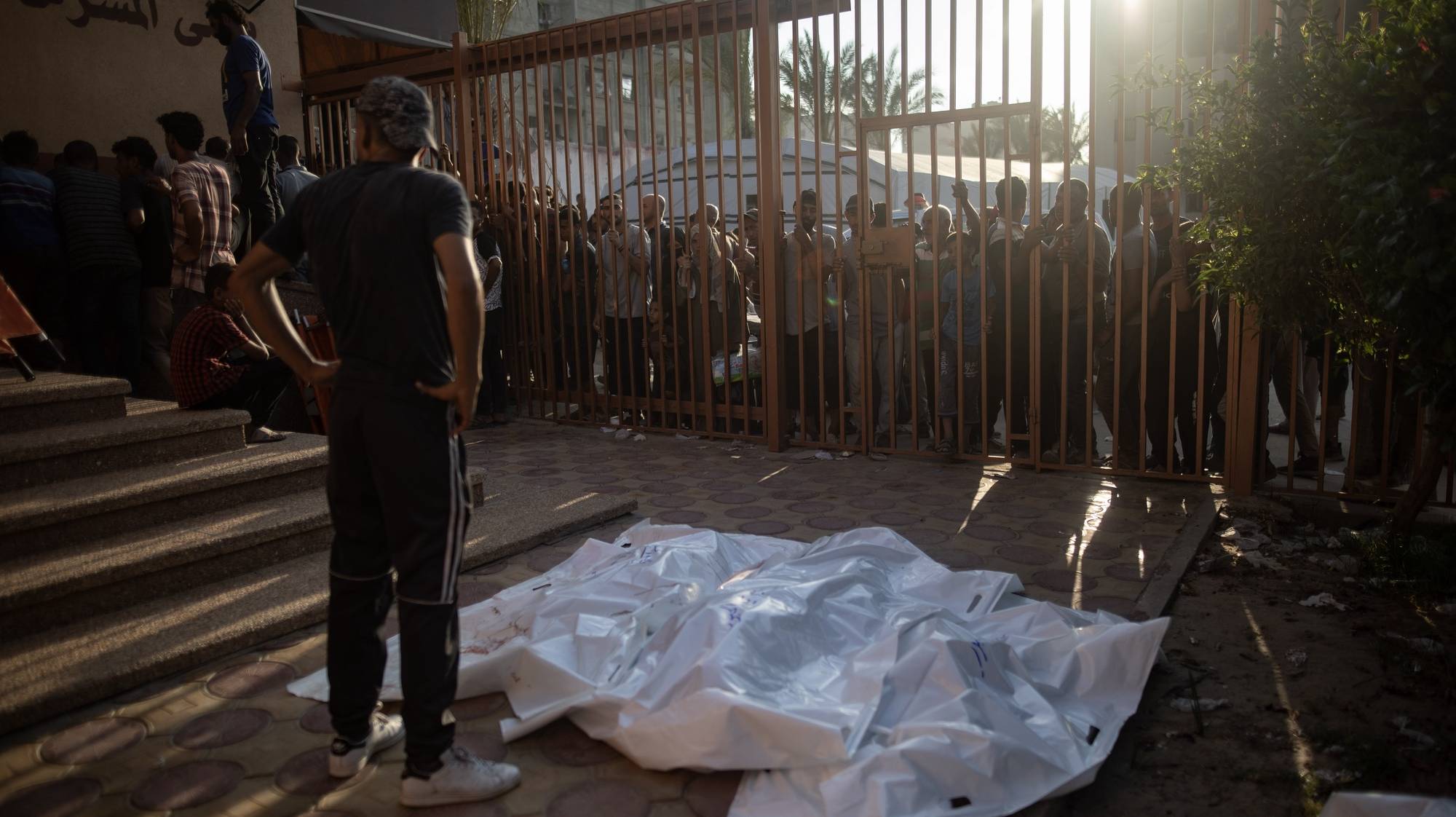 epa11491737 Palestinians cry next to the bodies of their relatives at Nasser Hospital in Khan Yunis after the Israeli bombing east of Khan Yunis camp in the southern Gaza Strip on July 22, 2024. More than 39,000 Palestinians and over 1,400 Israelis have been killed, according to the Palestinian Health Ministry and the Israel Defense Forces (IDF), since Hamas militants launched an attack against Israel from the Gaza Strip on 07 October 2023, and the Israeli operations in Gaza and the West Bank which followed it.  EPA/HAITHAM IMAD