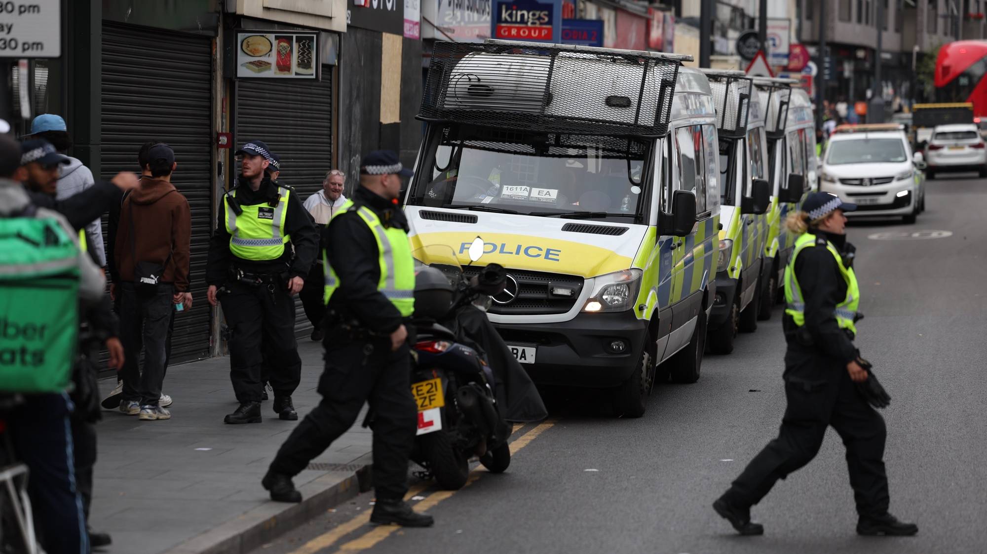 epa11534139 Police officers in Walthamstow, east London, Britain, 07 August 2024. Further far-right protests are expected on 07 August 2024. Violent demonstrations have been held by members of far-right groups across Britain following a fatal stabbing attack in Southport, in which three children were killed and eight more seriously injured, along with two adults.  EPA/ANDY RAIN