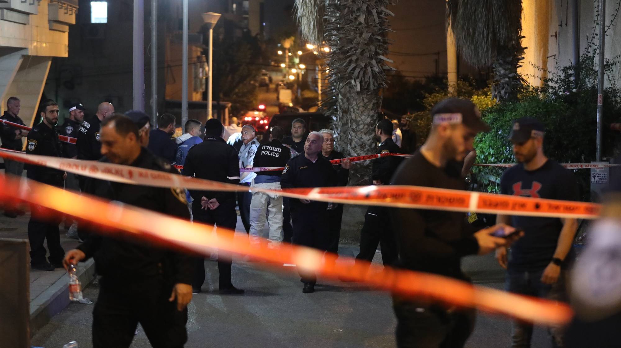 epa09858789 Israeli emergency personnel at the scene of attack in city of Bnei Brak, near Tel Aviv, Israel, 29 March 2022. According to emergency services, at least five Israelis where killed in a shooting attack by Israeli Arab gunmen.  EPA/ABIR SULTAN