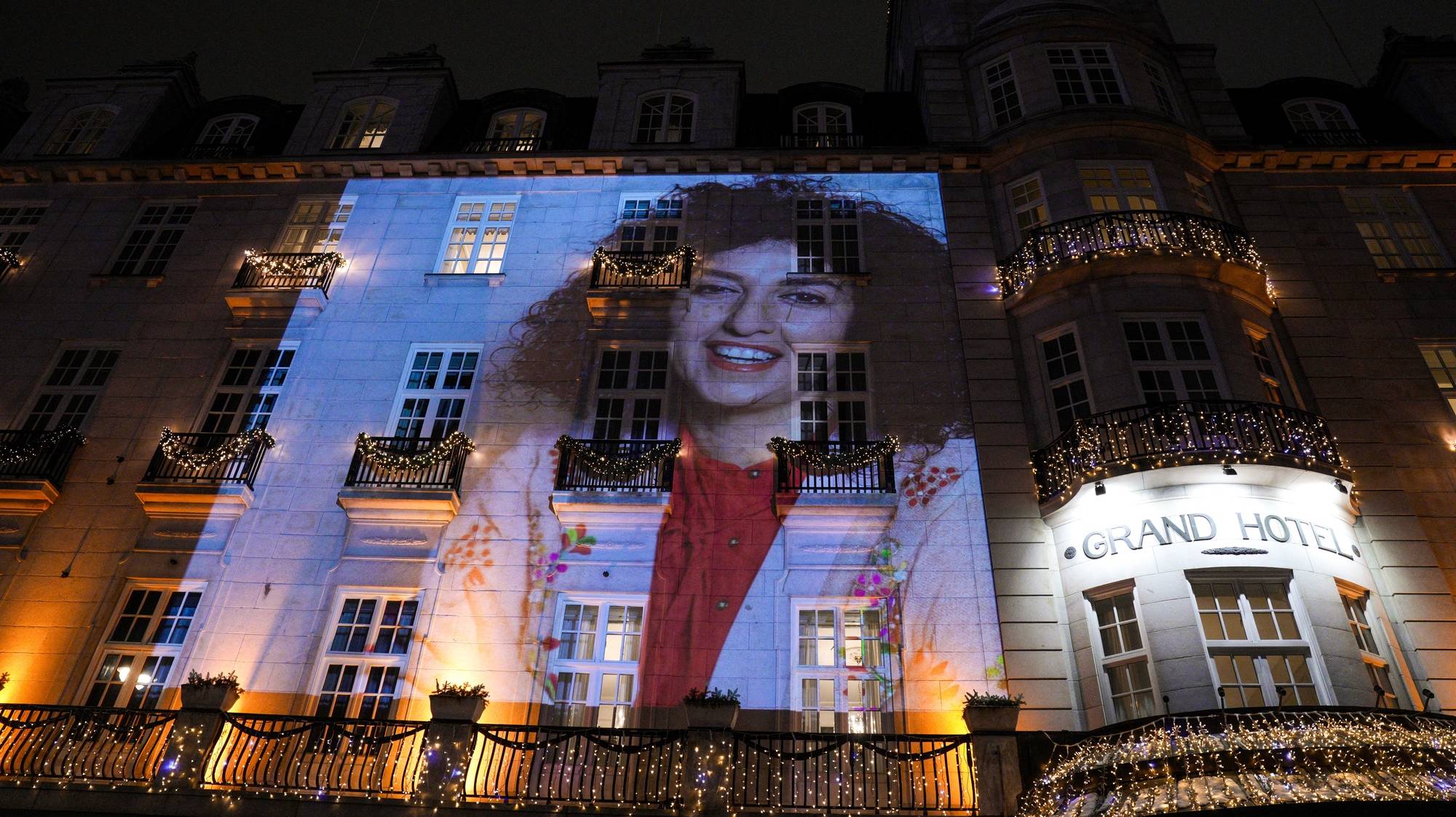 epa11021738 Picture of the 2023 Nobel Peace Prize winner Narges Mohammadi on the wall of the Grand Hotel before the Nobel banquet in Oslo after the Nobel Peace Prize 2023 ceremony in Oslo, Norway, 10 December 2023. Iranian human rights activist and Nobel Peace Prize 2023 winner, Narges Mohammadi, is imprisoned and is therefore represented by her children Ali and Kiana Rahmani and husband Taghi Rahmani. Mohammadi receives the peace prize for her fight against the oppression of women in Iran and the fight for human rights and freedom for all.  EPA/JAVAD PARSA / POOL  NORWAY OUT