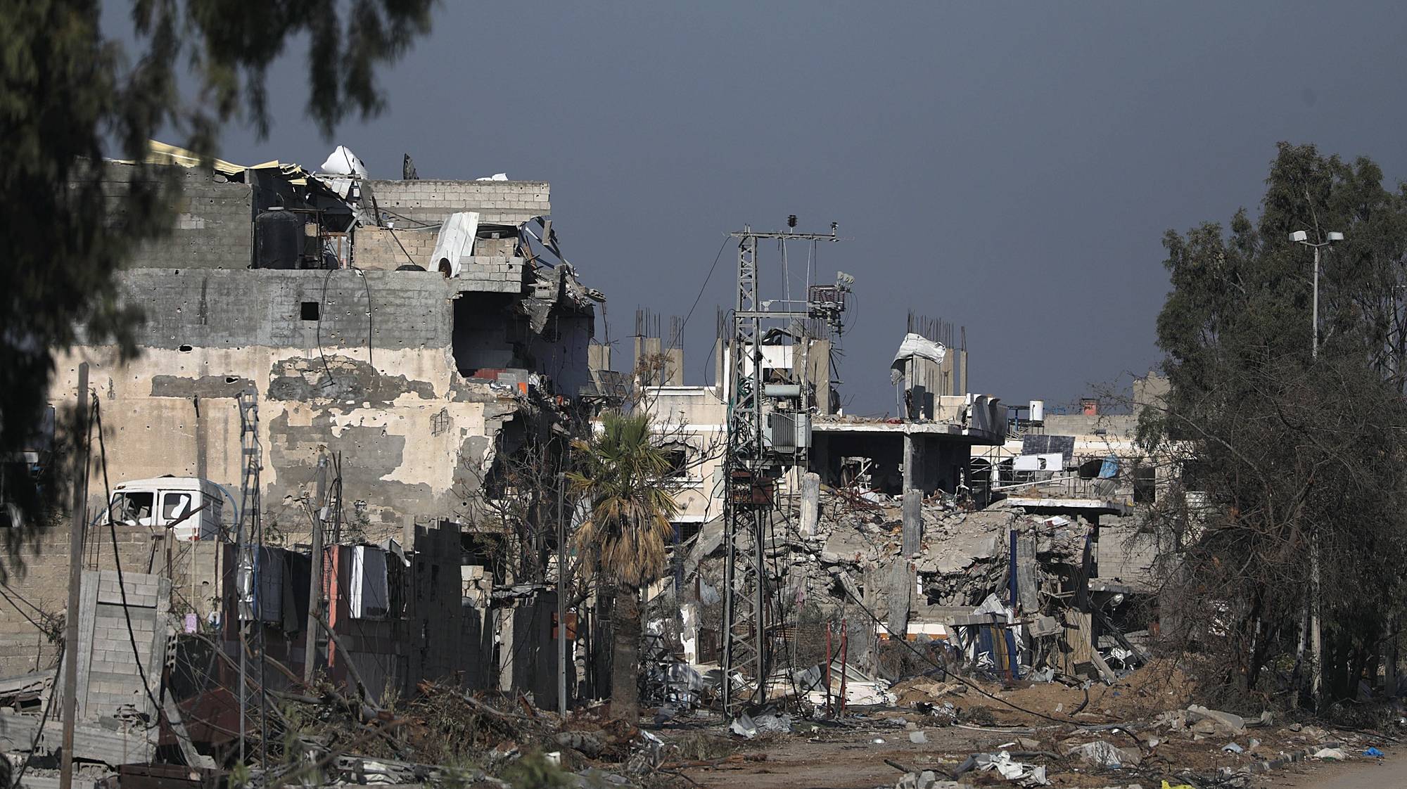 epa11001328 Destruction in the northern Gaza Strip is seen from Salah Al Din road in the central Gaza Strip, 29 November 2023. The four-day ceasefire agreed upon by Israel and Hamas was extended by 48 hours on 27 November, followed by more talks about a possible further extension. The Israeli army on 29 November has reissued its daily message to the residents of Gaza to avoid moving back into northern Gaza which is considered a “war zone&quot;, to not approach within one kilometer of the border and to not access the sea.  EPA/MOHAMMED SABER