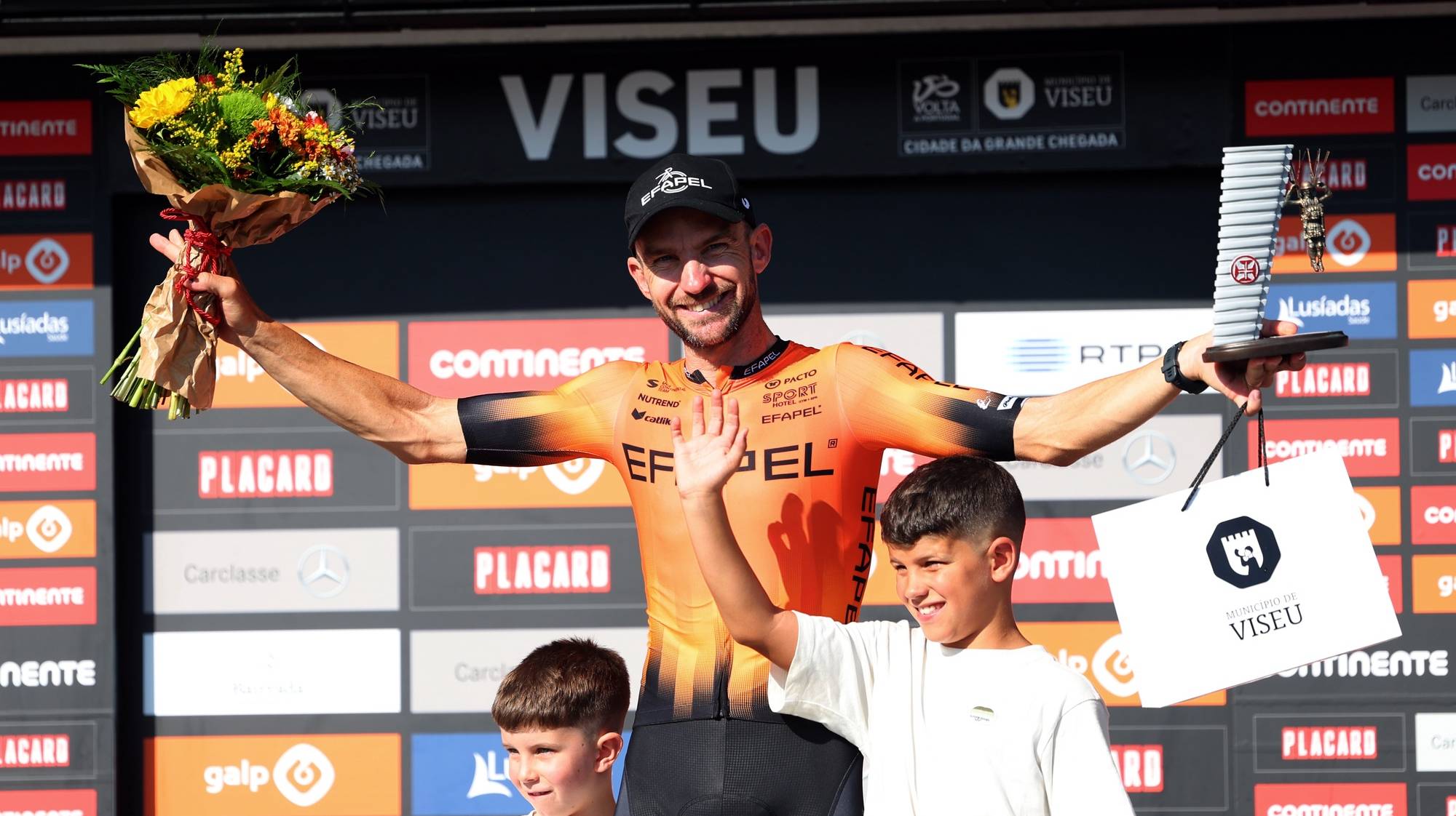 Portuguese rider Henrique Casimiro (Efapel) holds the prize of Combativity after announcing his retirement from cycling, at the podium at the end of the 85th edition of the Portugal Cycling tour in Viseu, Portugal, 04 August 2024. NUNO VEIGA/LUSA