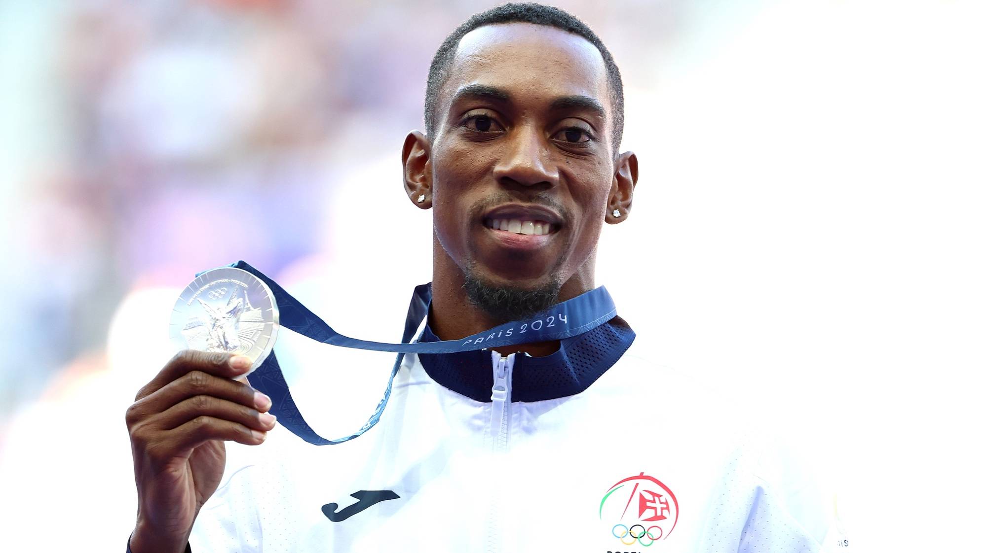 epa11543446 Silver medalist Pedro Pichardo of Portugal during the medal ceremony for the Men Triple Jump event of the Athletics competitions in the Paris 2024 Olympic Games, at the Stade de France stadium in Saint Denis, France, 10 August 2024.  EPA/VASSIL DONEV