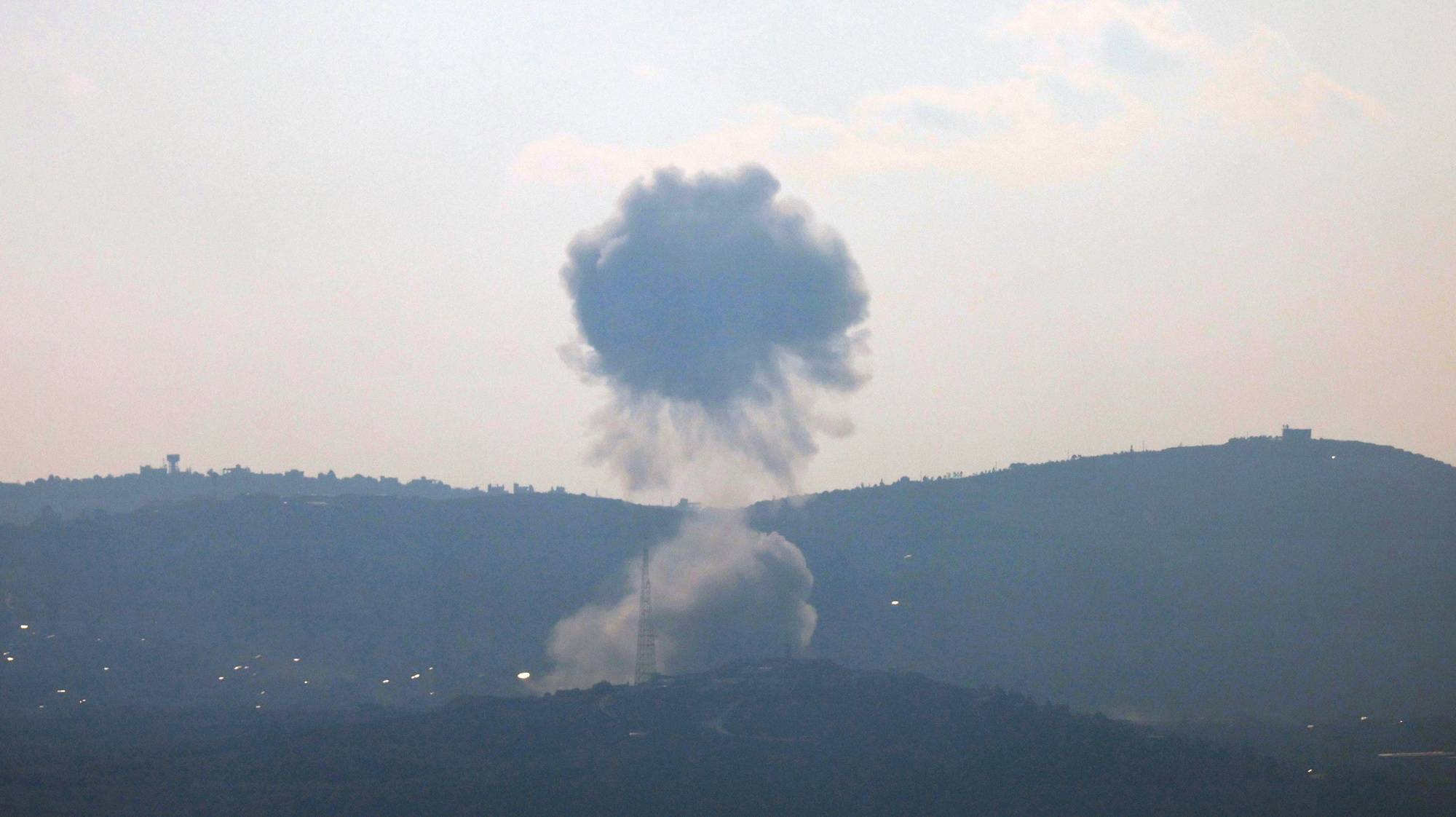 epa11531129 Smoke rises as a following Israeli shelling on the village of Kfarkila, south Lebanon, as seen form the Upper Galilee, northern Israel, 06 August 2024. The Israeli army reported that the  Aerial Defense Array successfully intercepted 40 missiles fired from Lebanon.  EPA/ATEF SAFADI