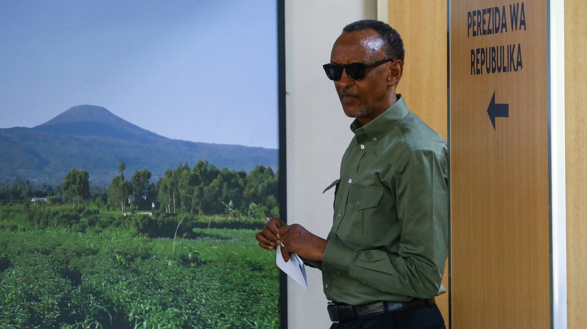 epa11479721 Rwandan President Paul Kagame casts his vote at SOS Technical High School in Kigali, Rwanda, 15 July 2024. Incumbent President of Rwanda Paul Kagame is seeking a fourth term as 9.7 million Rwandan citizens are eligible to vote to choose a president and members of parliament who will serve for the next five years.  EPA/DANIEL IRUNGU