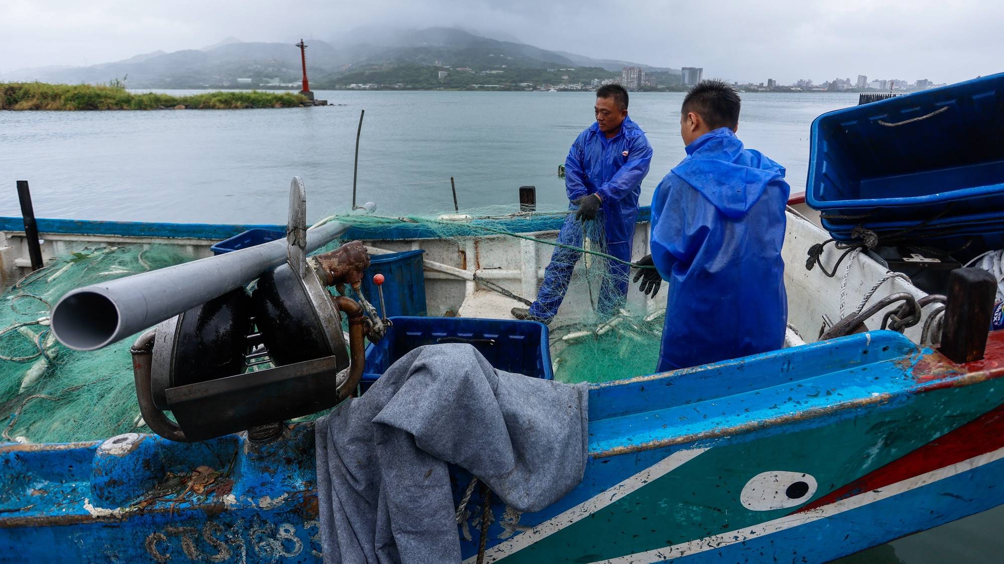 epa11493404 Fishermen anchor their boats at a typhoon shelter to brace for Typhoon Gaemi, in New Taipei, Taiwan, 24 July 2024. After having hovered in the waters of the Philippines, Typhoon Gaemi is expected to make landfall in Taiwan on the evening of 24 July, with the Taiwanese weather agency issuing sea and land warnings. People are also reminded to monitor changes to international and domestic flights as disruptions may occur due to the tropical storm that brings in heavy rain and powerful winds.  EPA/Daniel Ceng