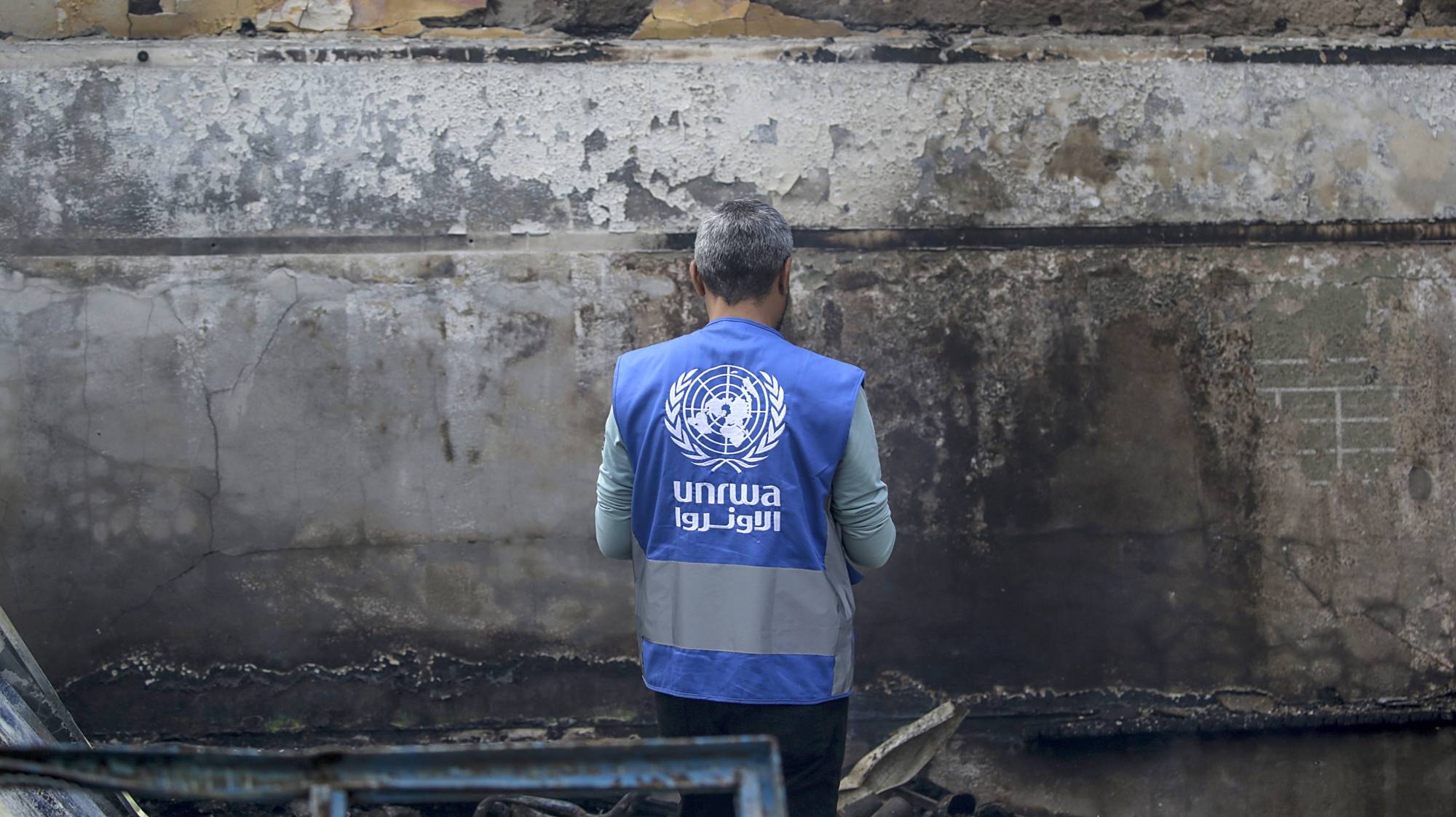 epa11339654 Unrwa employee inspects a destroyed United Nations school following an air strike in Al Nuseirat refugee camp, central Gaza Strip, 14 May 2024.  At least six people were killed in the strike which hit the UNRWA (United Nationas Relief and Works Agency for Palestinians in the near east) school, according to the Palestinian Civil Defense in Gaza. More than 35,000 Palestinians and over 1,455 Israelis have been killed, according to the Palestinian Health Ministry and the Israel Defense Forces (IDF), since Hamas militants launched an attack against Israel from the Gaza Strip on 07 October 2023, and the Israeli operations in Gaza and the West Bank which followed it.  EPA/MOHAMMED SABER