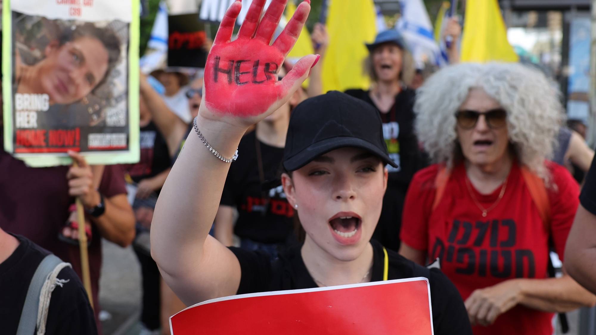 epaselect epa11470384 A demonstrator with her hand painted in red takes part in a protest march against Israeli Prime Minister Netanyahu&#039;s government and calling for the release of the hostages, outside the Kirya military headquarters in Tel Aviv, Israel, 10 July 2024. Some hostage families announced that they will begin a four-day march toward the Knesset in Jerusalem. According to the Israeli military, 116 Israelis, who were abducted and taken to the Gaza Strip during the 07 October 2023 attacks by Hamas, remain in captivity. Rallies in Israel have been critical of the government&#039;s handling of the crisis, demanding the immediate release of all hostages.  EPA/ABIR SULTAN