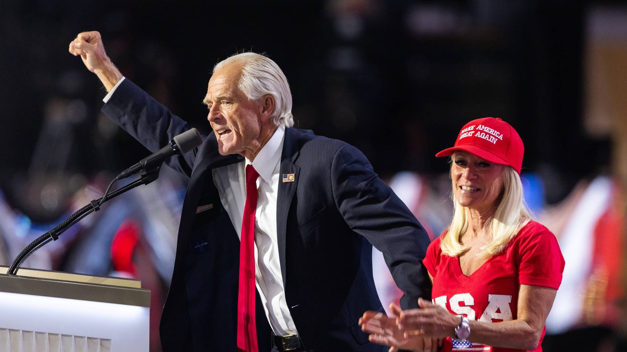 epa11484439 Former Director of the U.S. Office of Trade and Manufacturing Policy Peter Navarro (L) alongside his girlfriend Bonnie (R), delivers remarks during the third day of the Republican National Convention (RNC) in the Fiserv Forum in Milwaukee, Wisconsin, USA, 17 July 2024. The convention comes just a few days after a 20-year-old Pennsylvania man attempted to assassinate former president and current Republic presidential nominee Donald Trump. The RNC is being held 15 to 18 July 2024 and is where delegates from the Republican Party select their nominees for president and vice president in the 2024 US presidential election.  EPA/JIM LO SCALZO