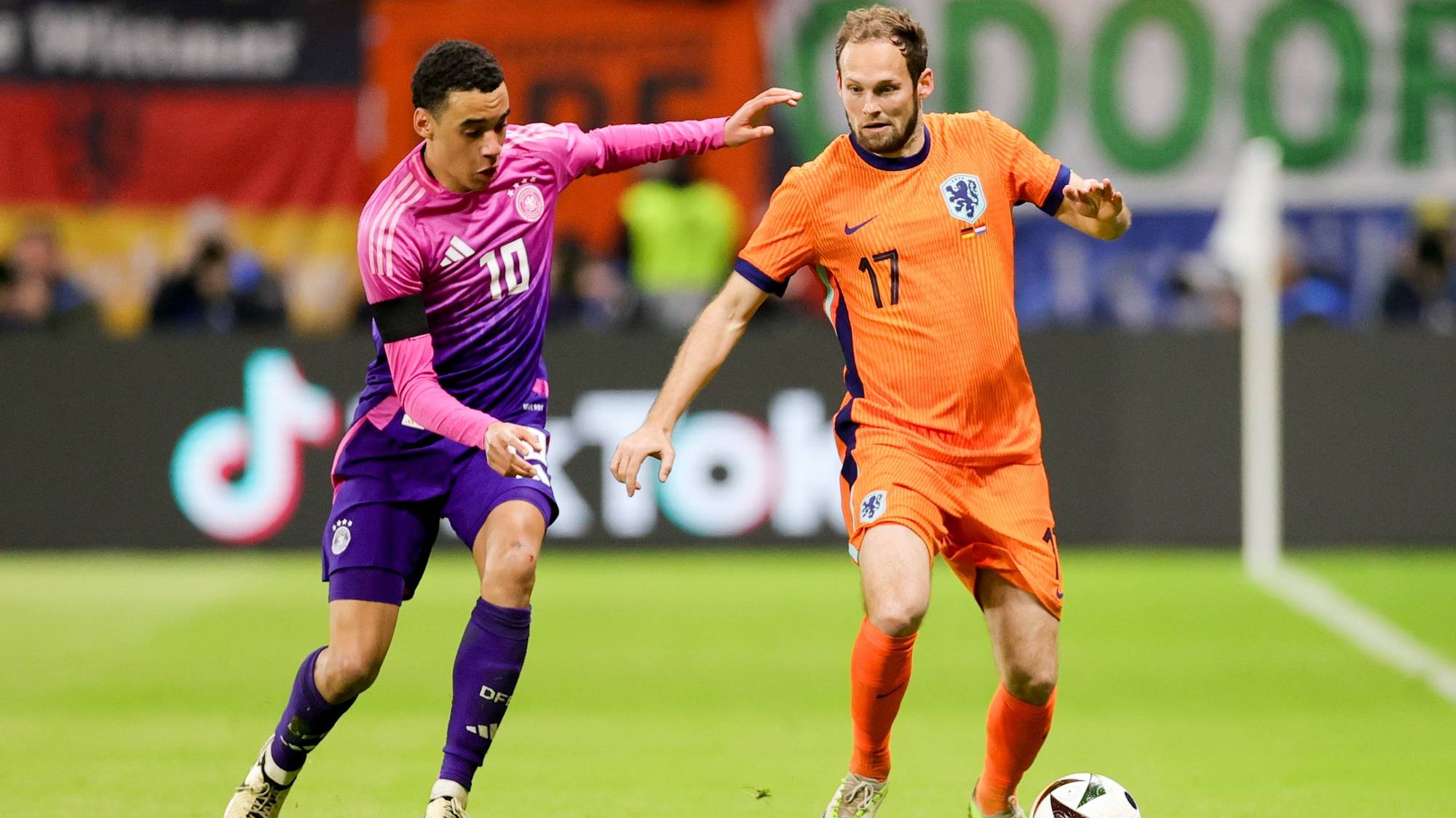 epa11245650 Germany&#039;s Jamal Musiala (L) and Netherlands&#039; Daley Blind in action during the friendly international soccer match between Germany and the Netherlands in Frankfurt am Main, Germany, 26 March 2024.  EPA/FRIEDEMANN VOGEL