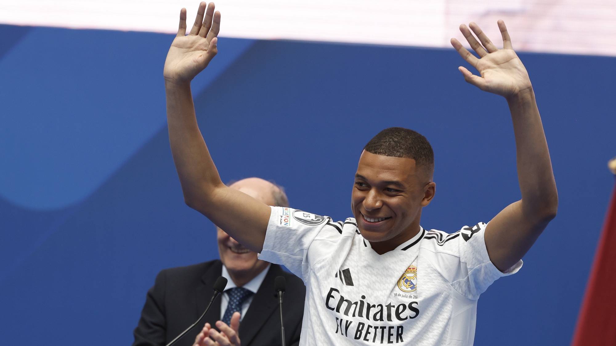 epa11481373 French soccer player Kylian Mbappe reacts during his presentation as Real Madrid&#039;s newest team member, at Santiago Bernabeu Stadium in Madrid, Spain, 16 July 2024. With the number 9 on his back, the Paris-born captain of the French national team said the move to the Bernabeu was a dream come true.  EPA/Ballesteros