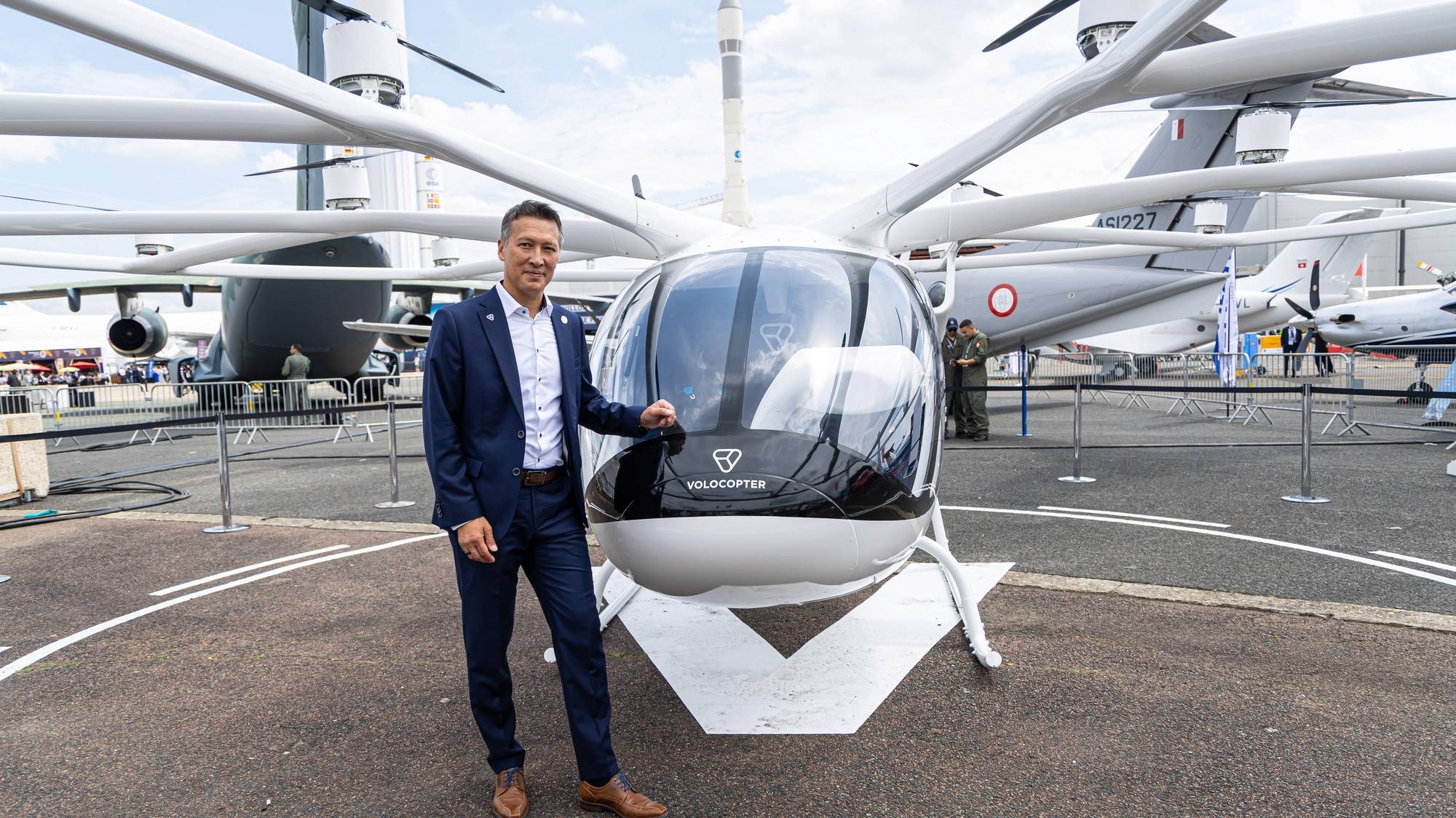 epa10700069 Dirk Hoke, CEO of Volocopter poses for photographs next to the VoloCity, an urban air taxi  electric powered, during the International Paris Air Show, in Le Bourget, north of Paris, France, 19 June 2023. Aviation industry CEOs and top government officials from around the world descended on the Paris Air Show on 19 June for a week of deal-making and demonstrations of the world&#039;s latest air and space technology.  EPA/CHRISTOPHE PETIT TESSON