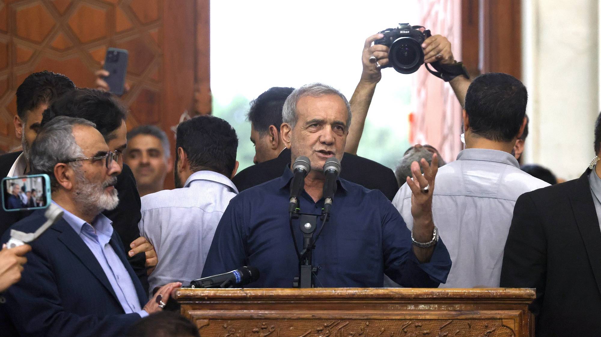 epa11463154 Iranian elected president Masoud Pezeshkian (C) speaks to the crowd after winning the presidential elections, at the Khomeini shrine in southern Tehran, Iran, 06 July 2024.  EPA/STR