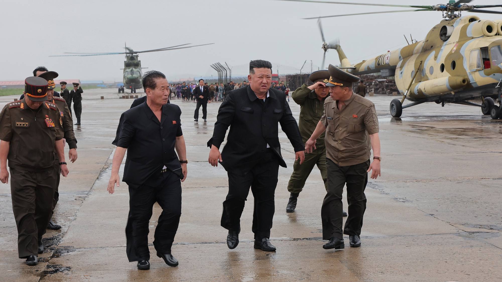 epa11504803 A photo released by the official North Korean Central News Agency (KCNA) shows North Korean leader Kim Jong Un (C) inspecting a flood-hit area in North Phyongan Province, North Korea, 28 July 2024 (issued 29 July 2024). According to KCNA, a record downpour hit the northern border of North Korea and China on 27 July caused the water level of the Amnok River to far exceed the danger line, affecting more than 5,000 inhabitants in several islet areas of Sinuiju City and Uiju County of North Phyongan Province.  EPA/KCNA  EDITORIAL USE ONLY