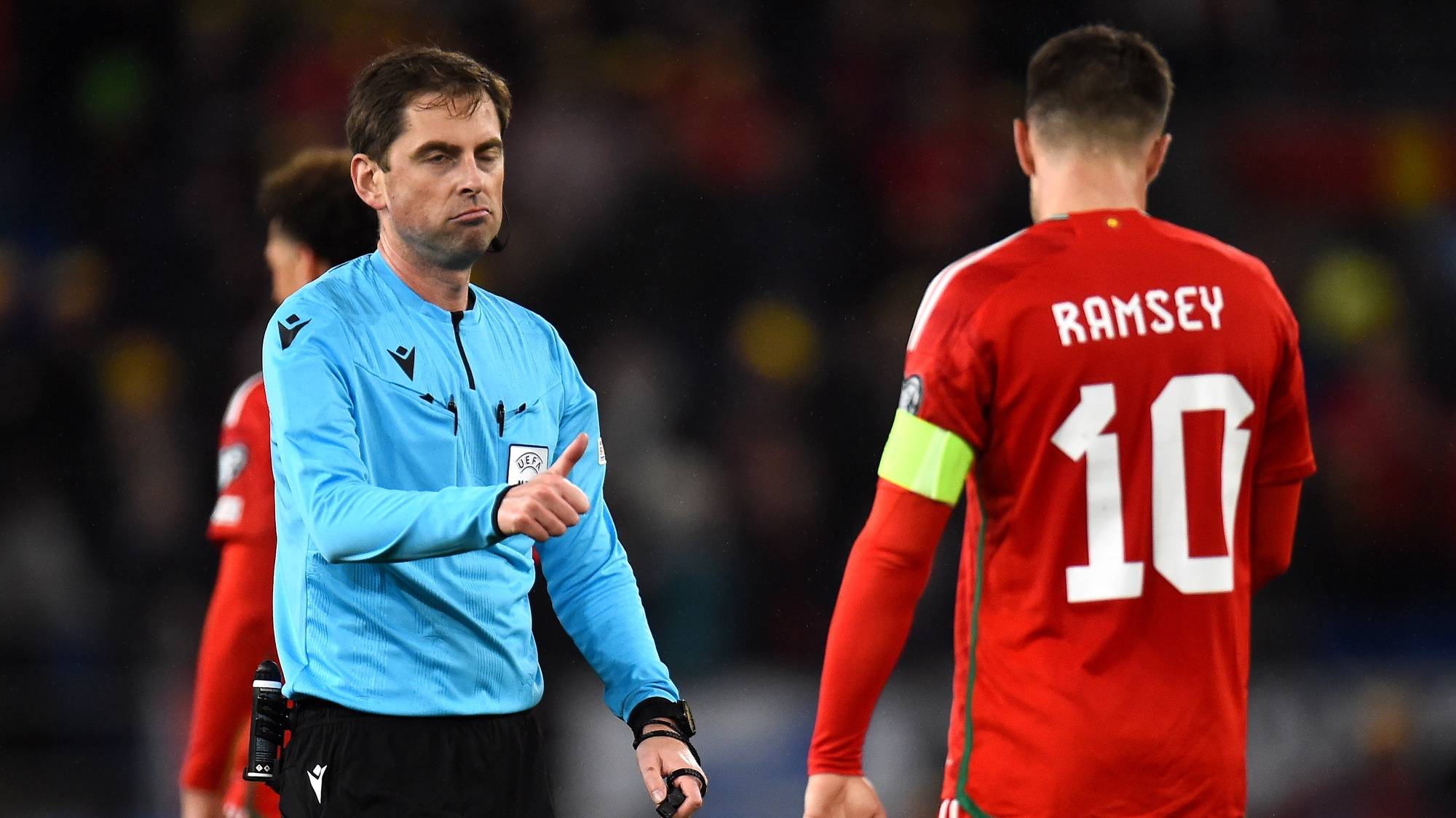epa10547855 Referee Giorgi Kruashvili gestures to Wales&#039; captain Aaron Ramsey during the UEFA EURO 2024 qualification match between Wales and Latvia in Cardiff, Britain, 28 March 2023.  EPA/Peter Powell