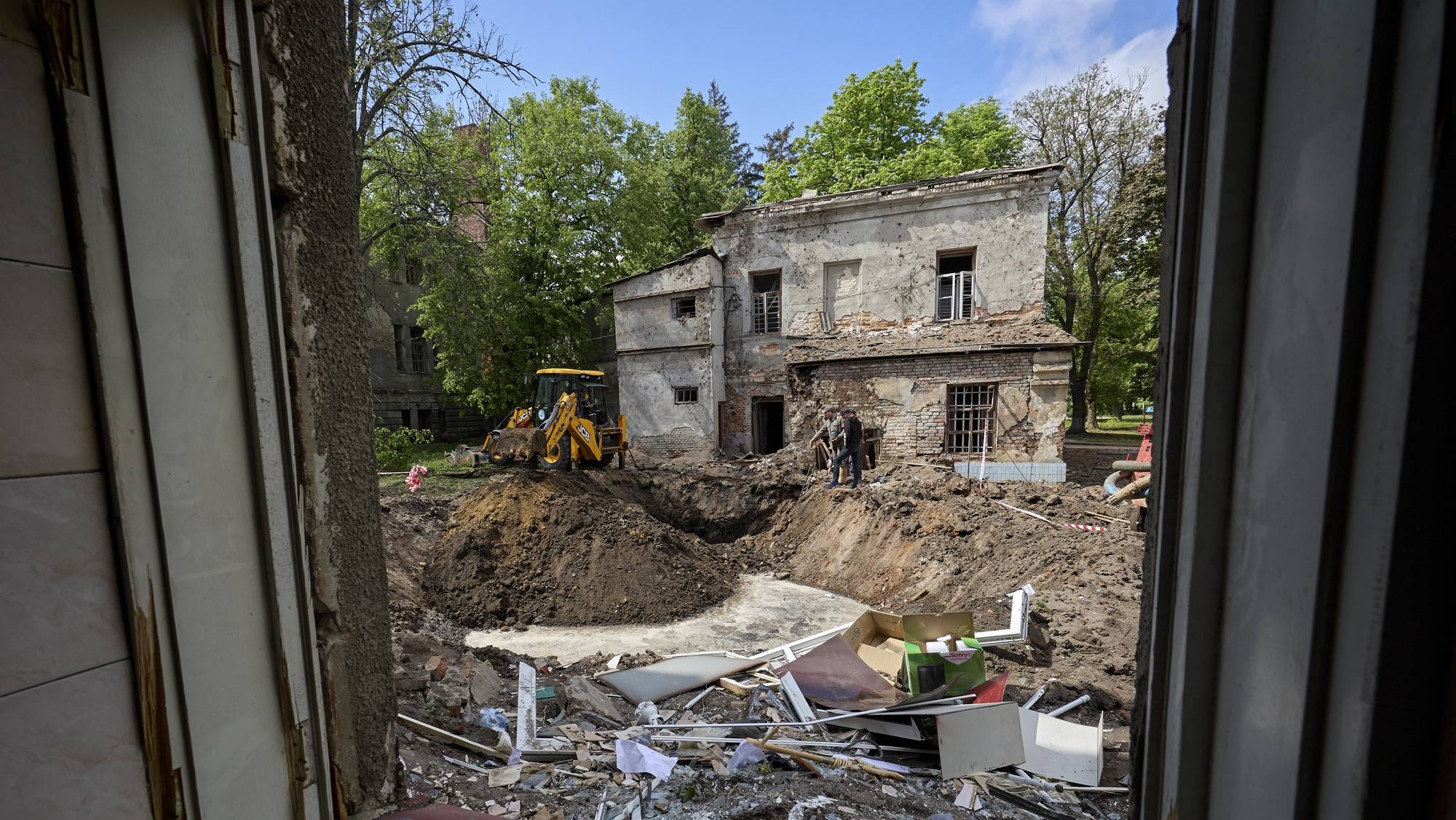 epa11304560 Communal workers operate at the site of a rocket attack on a regional psychiatric hospital in Kharkiv, northeastern Ukraine, 27 April 2024. According to the Regional Prosecutor&#039;s Office Russia hit the city with two missiles of the S-300 type from the territory of the Belgorod region. In total, Russia used 34 air, ground, and sea-based missiles for the night time shelling of Ukraine as Air Force Command of UA Armed Forces reported. 21 were shot down by Ukrainian troops. As a result of the attack, the enterprise equipment of the four thermal power plants was seriously damaged according to the DTEK Group energy holding report.  EPA/SERGEY KOZLOV