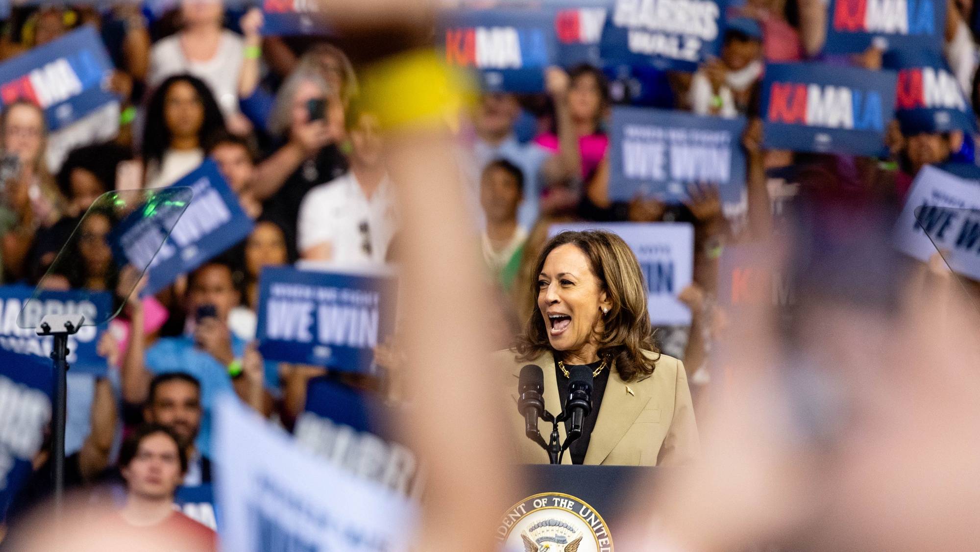 epa11541517 Democratic presidential candidate US Vice President Kamala Harris speaks during a campaign rally at the Desert Diamond Arena in Phoenix, Arizona, USA, 09 August 2024.  EPA/CASSIDY ARAZIA