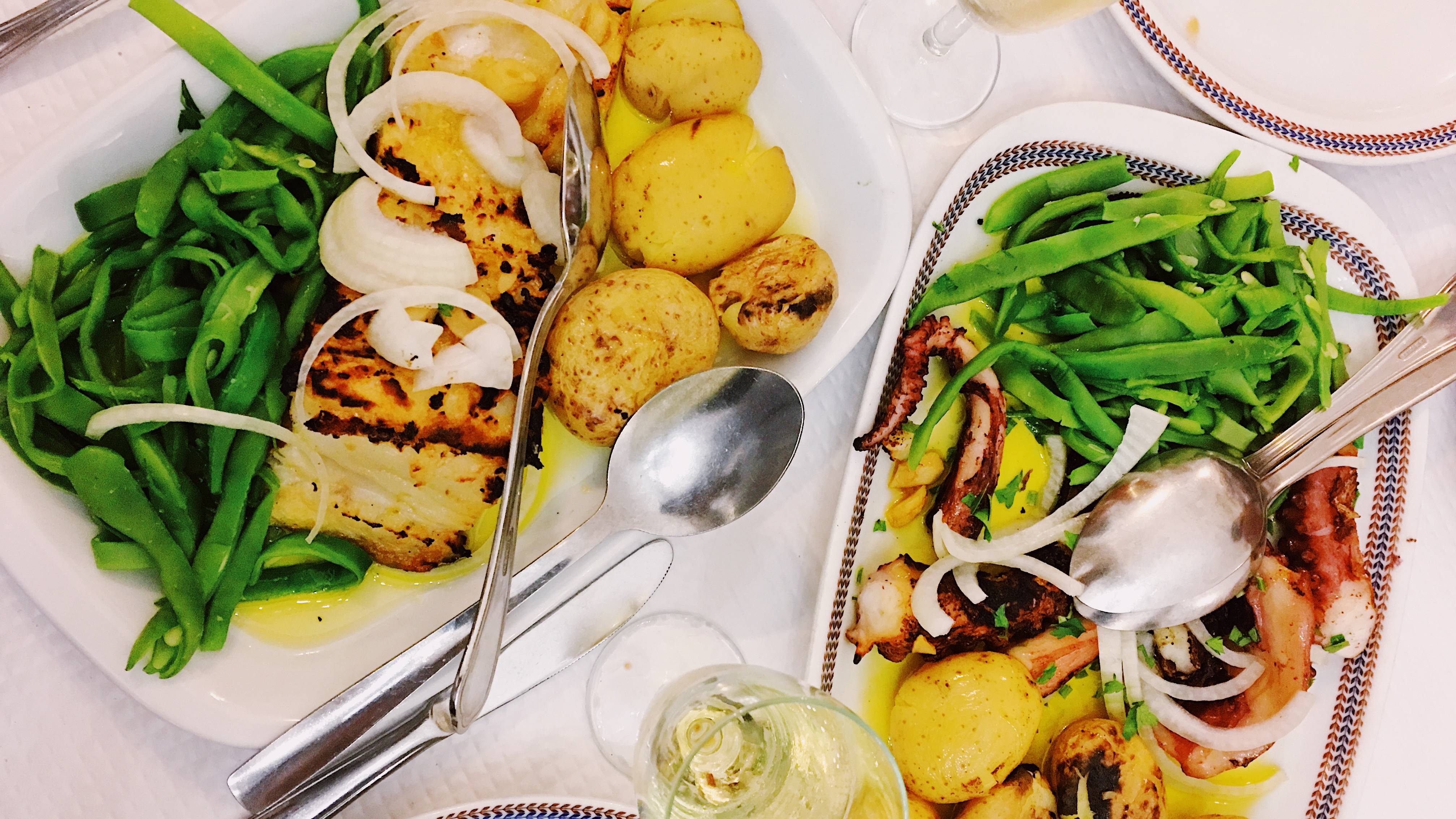 Traditional Portuguese food - bacalhau (dried cod), octopus, potato and green peas