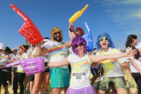 Competitors take part in The Color Run on December 14 in Dubai, United Arab Emirates.