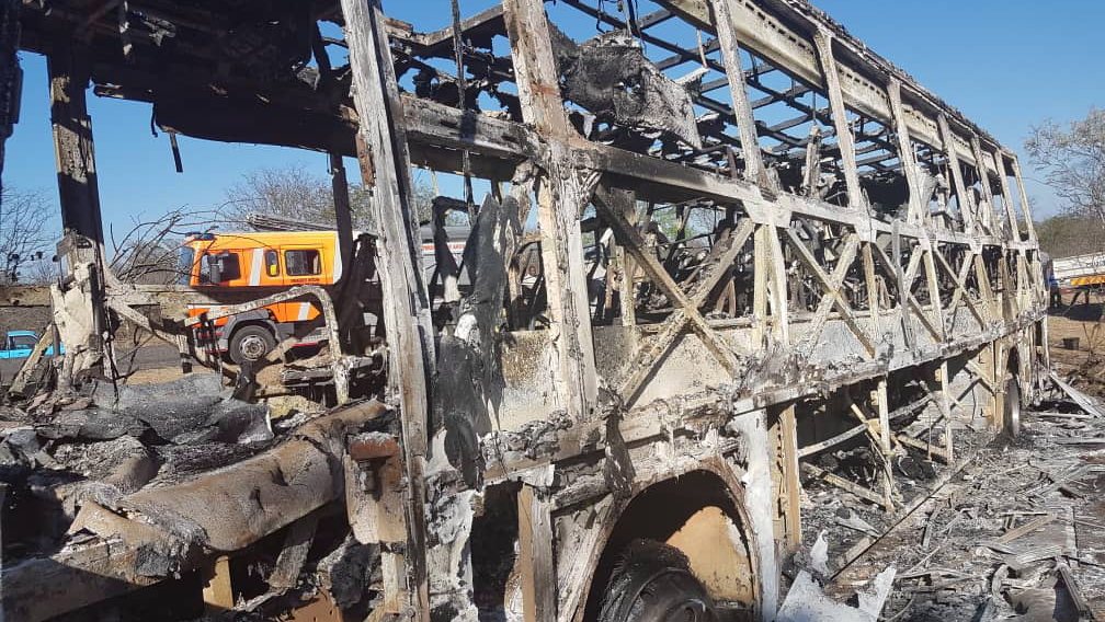 epa07170473 A general view of the wreckage of a bus in which 42 people died and 27 seriously injured when it burst into flames  in West Nicholson, Mateabeleland, southern Zimbabwe, 15 November 2018, (issued 16 November 2018). Reports state that the bus burst into flames after a smelll of an hazardous substance was detected. The bus was on the way to Musina, South Africa.  EPA/STR