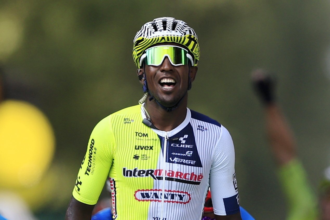epa11450076 Eritrean rider Biniam Girmay of Intermarche-Wanty celebrates as he crosses the finish line to win the third stage of the 2024 Tour de France cycling race over 230km from Piacenza to Turin, Italy, 01 July 2024.  EPA/GUILLAUME HORCAJUELO
