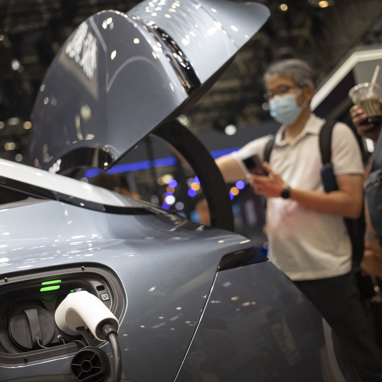 epa11315713 A Zeeker 007 electric car is plugged to a charger at the 2024 Beijing International Automotive Exhibition in Beijing, China, 03 May 2024. 2024 Beijing International Automotive Exhibition will be held until 04 May 2024.  EPA/ANDRES MARTINEZ CASARES