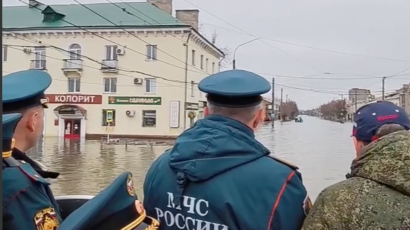 epa11263754 A photo taken from a handout video made available by the Russian Emergency Situations Ministry shows Russian Emergencies Minister Alexander Kurenkov (C) inspects the flood zone in Orsk, Orenburg region, Russia, 07 April 2024. The dam failure caused by the high water level of the Ural River, which rose approximately 10 meters, has put over 4,000 houses and nearly 11,000 people in the flooding zone, according to Russian Emergency Situations Ministry.  EPA/RUSSIAN EMERGENCY SITUATIONS MINISTRY PRESS SERVICE / HANDOUT MANDATORY CREDIT - BEST QUALITY AVAILABLE  HANDOUT EDITORIAL USE ONLY/NO SALES HANDOUT EDITORIAL USE ONLY/NO SALES