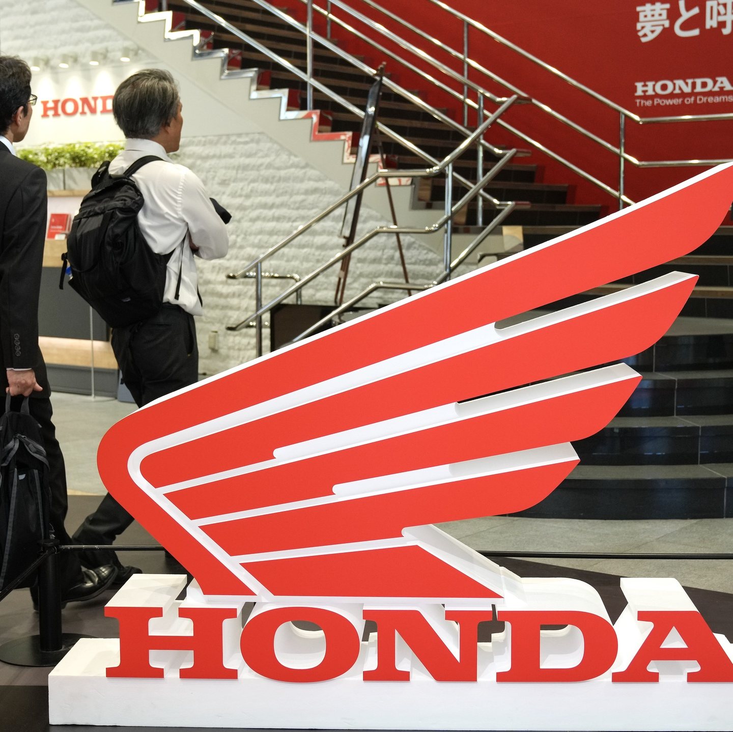 epa11330819 Visitors walk past the Honda Motorcycle logo at Honda Motor headquarters in Tokyo, Japan, 10 May 2024. Honda Motor announced its financial results for the fiscal year until 31 March 2024, with sales revenue increased by 20.8 percent to 20,428.8 billion Japanese Yen (around 121 billion Euro) from the 2023 fiscal year, due to among others an increased sales revenue in the automobile business. The company also reported an increased operating profit by 77.0 per cent to 1,381.9 billion yen (around 8 billion Euro) from the previous fiscal year.  EPA/KIMIMASA MAYAMA