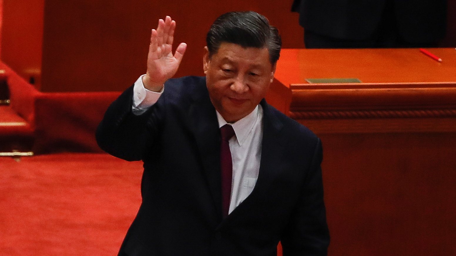 epa09877629 Chinese President Xi Jinping gestures to the crowd after the commending meeting for Beijing 2022 Winter Olympic and Paralympic games at the Great Hall of the People in Beijing, China, 08 April 2022. The 2022 Winter Olympics were held in Beijing from 04 to 20 February, while the 2022 Winter Paralympics were held from 04 to 13 March 2022.  EPA/MARK R. CRISTINO