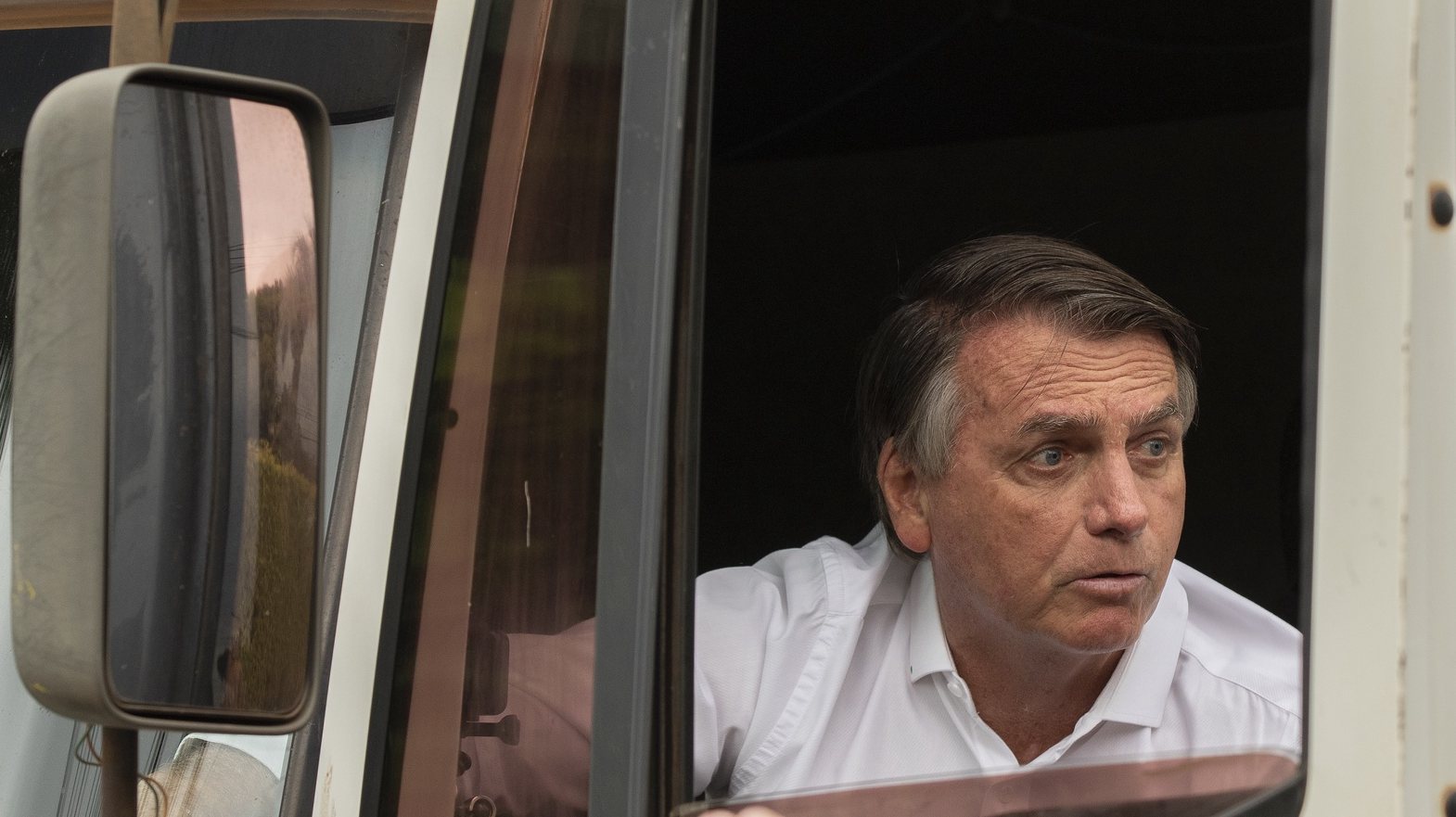 epa10229430 Jair Bolsonaro, president of Brazil and candidate for re-election, is seen in a truck where he will record an electoral propaganda video in Brasilia, Brazil, 07 October 2022. Bolsonaro will face Former Brazilian President Luiz Inacio Lula da Silva (PT) in the second round of the presidential elections on 30 October.  EPA/Joedson Alves