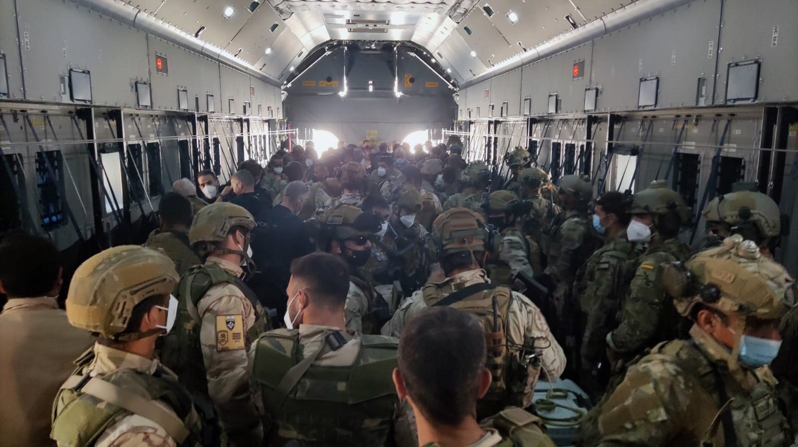 epa09431721 A handout photo made available by the Spanish Defense Ministry shows troops aboard one of the aircrafts of the Spanish Armed Forces, which has transported the military and personnel of the Embassy that remained in Afghanistan and has arrived from Kabul in Dubai, United Arab Emirates, 27 August 2021. Spain has concluded the mission to evacuate people from Afghanistan.  EPA/Spanish Ministry of Defense HANDOUT  HANDOUT EDITORIAL USE ONLY/NO SALES