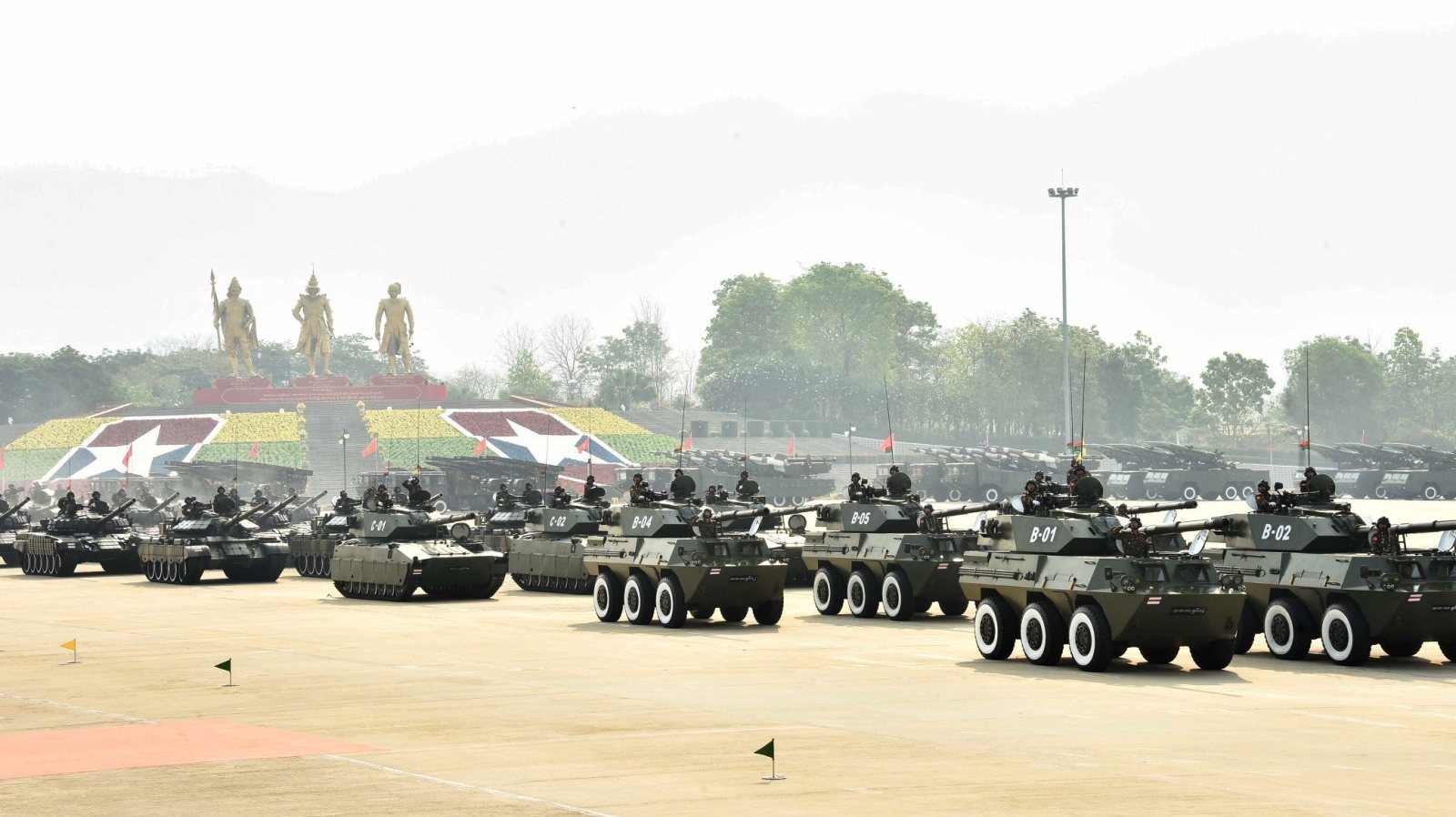 epa10545633 A handout photo made available by Myanmar Military Information Team shows Myanmar soldiers driving military vehicles during a parade commemorating the 78th Armed Forces Day in Naypyidaw, Myanmar, 27 March 2023.  EPA/MYANMAR MILITARY INFO TEAM / HANDOUT  HANDOUT EDITORIAL USE ONLY/NO SALES