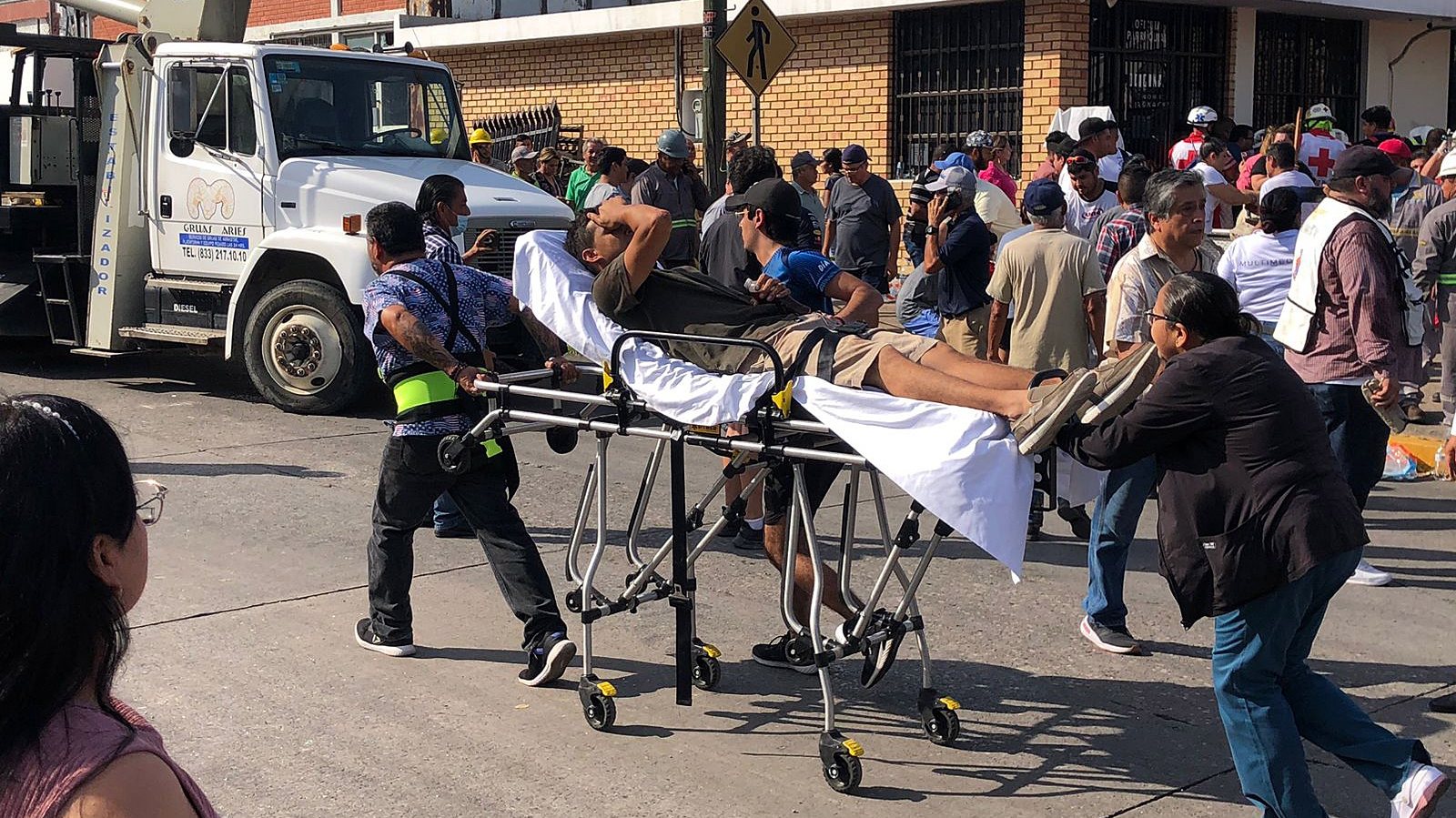 epa10895607 A man is carried away on a stretcher after the roof of a church collapsed killing at least 10 people in Ciudad Madero, Mexico, 01 October 2023 (issued 02 October 2023). At least 10 people died when the roof of a church collapsed during a baptism ceremony in the afternoon of 01 October.  EPA/STR