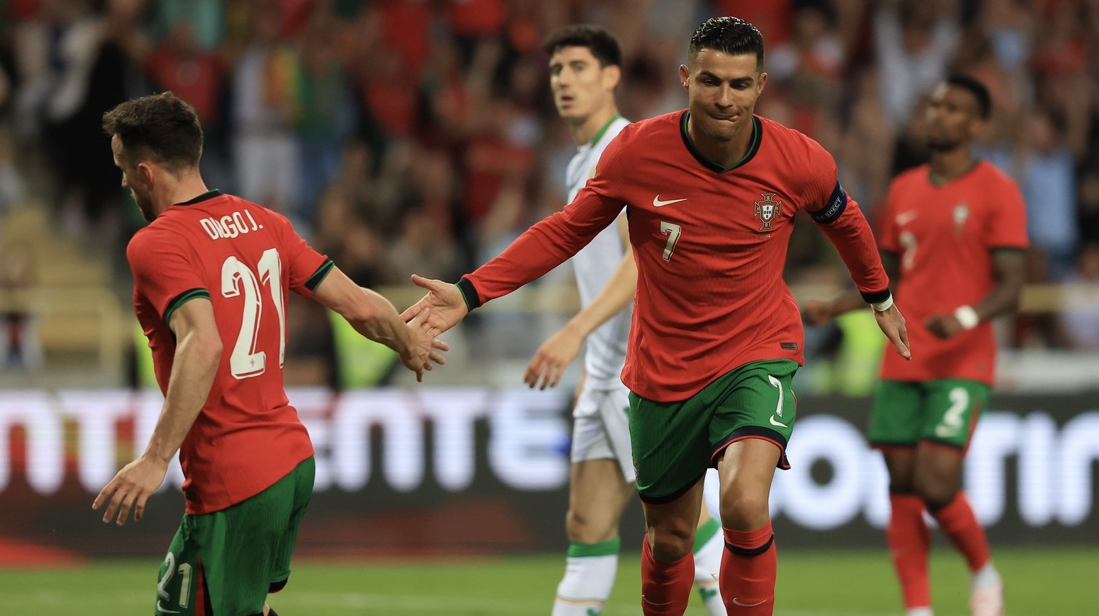 Portugal&#039;s Cristiano Ronaldo (R) celebrates with Diogo Jota after scoring a goal against Ireland during their friendly soccer match in preparation for the upcoming Euro 2024, held at Aveiro Municipal stadium, Aveiro, Portugal, 11 June 2024. JOSE COELHO/LUSA