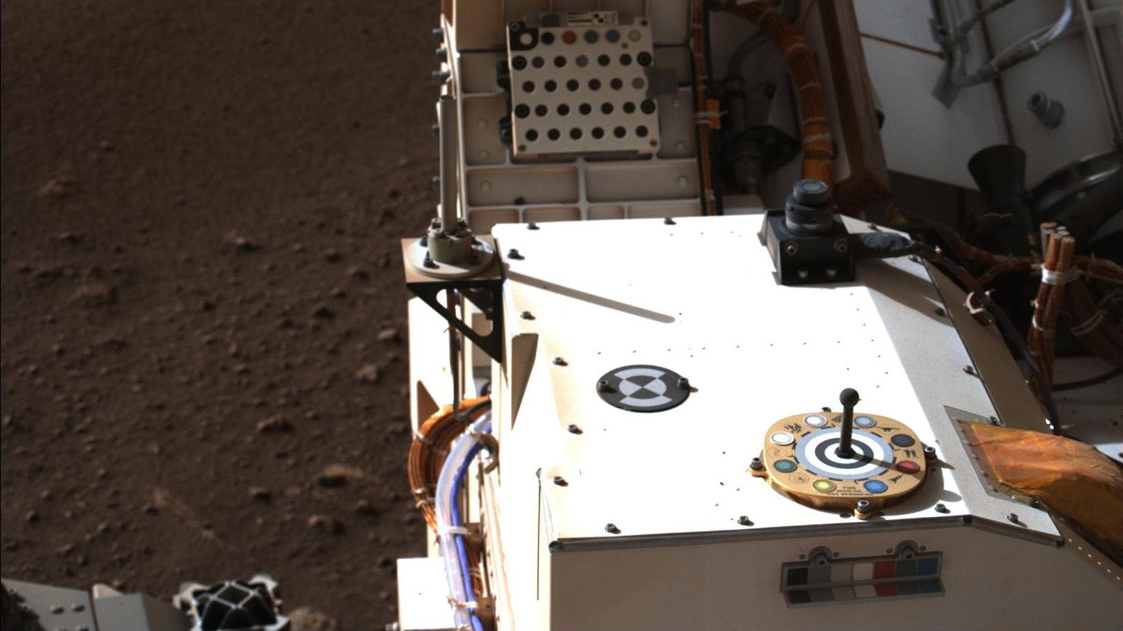 epa09030189 A handout photo made available by NASA shows Mastcam-Z, a pair of zoomable cameras aboard NASA’s Perseverance rover, images its calibration target for the first time since the rover landed on Mars on 18 February 2021 (Isuued on 22 February 2021). The target is used as a reference marker so scientists can adjust the colors and settings on the cameras. A key objective for Perseverance&#039;s mission on Mars is astrobiology, including the search for signs of ancient microbial life. The rover will characterize the planet&#039;s geology and past climate, pave the way for human exploration of the Red Planet, and be the first mission to collect and cache Martian rock and regolith.  EPA/NASA/JPL-Caltech HANDOUT  HANDOUT EDITORIAL USE ONLY/NO SALES