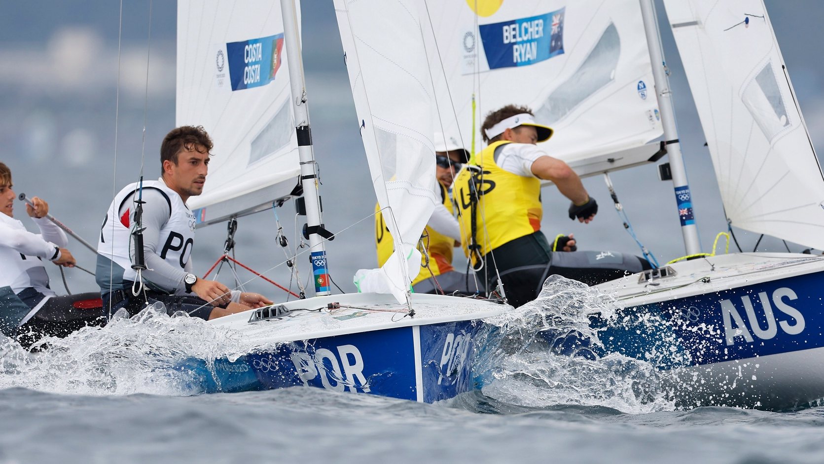 epa09379172 Diogo Costa and Pedro Costa of Portugal (L)  compete with Mathew Belcher and Will Ryan of Australia (R) in the Men&#039;s 470 Class discipline in the Sailing events of the Tokyo 2020 Olympic Games in Enoshima, Japan, 30 July 2021.  EPA/CJ GUNTHER