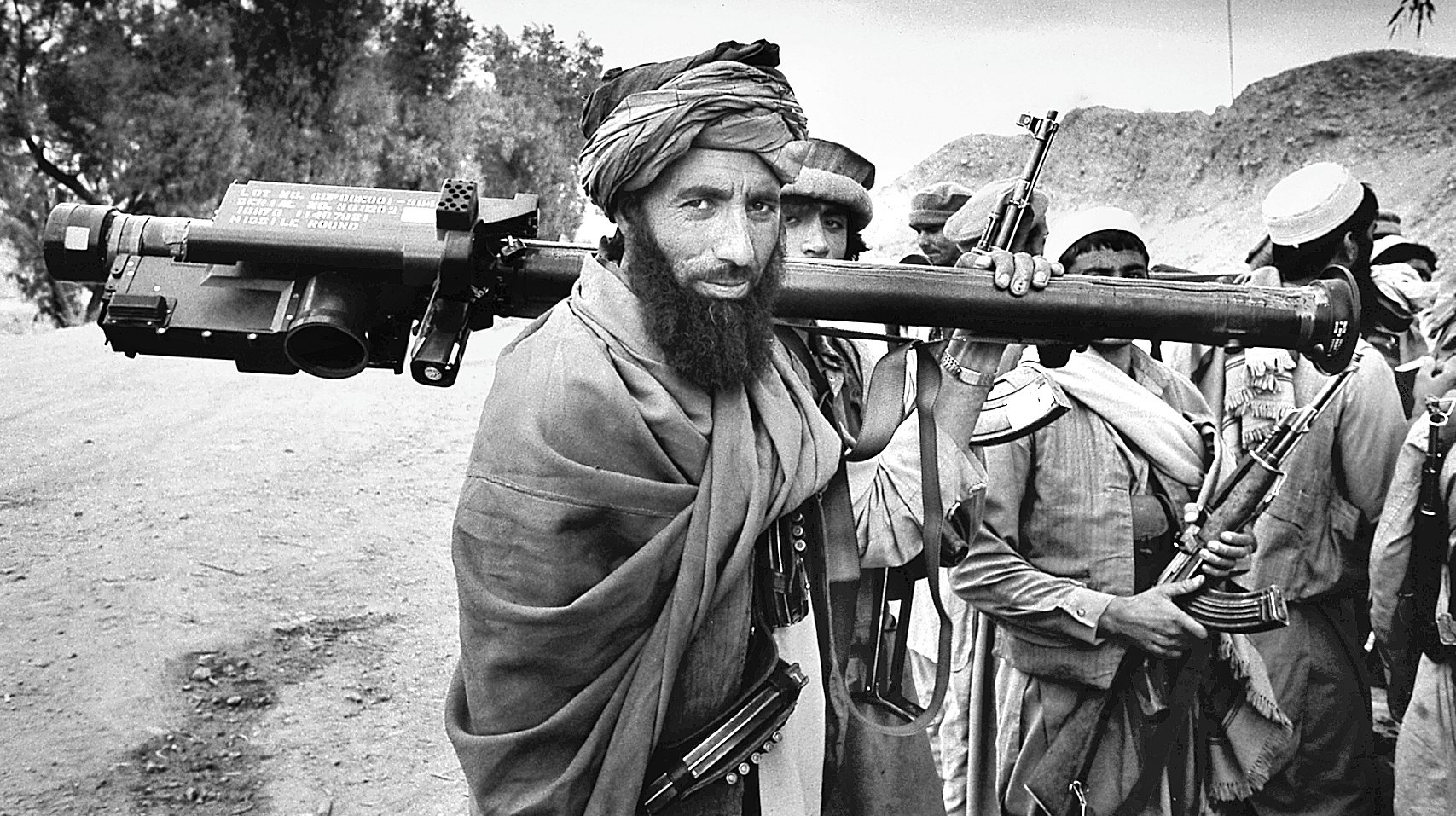 Afghan Mujahadeen fighter carries a U.S.-made shoulder-fired Stinger missile during the 1989 Jalalabad offensive in eastern Afghanistan. The weapon is capable of shooting down fast-moving aircraft by locking on to the heat signal generated by the engines.