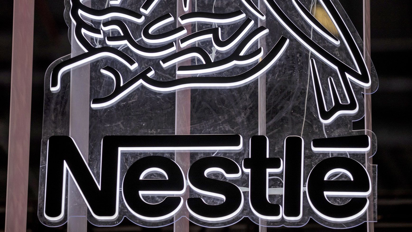 epa09018171 (FILE) - A Nestle logo is seen at the 3rd China International Import Expo in Shanghai, China, 07 November 2020 (reissued 17 February 2021). Nestle is due to release its 2020 full-year results on 18 February 2021.  EPA/ALEX PLAVEVSKI *** Local Caption *** 56531912